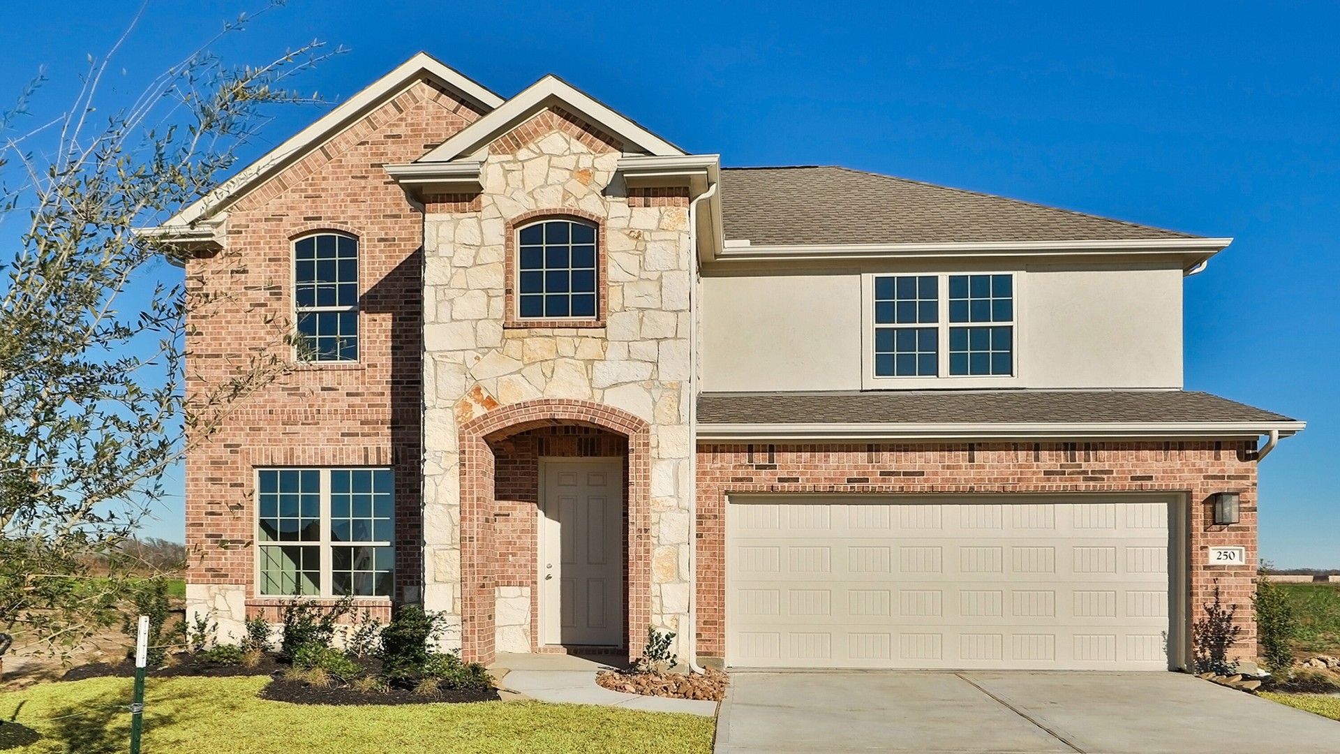 Elegant Two-Story Brick Home at Rosewood River Ranch:Discover elevated living in Rosewood. A striking brick façade and elegant archway define this exquisite residence.