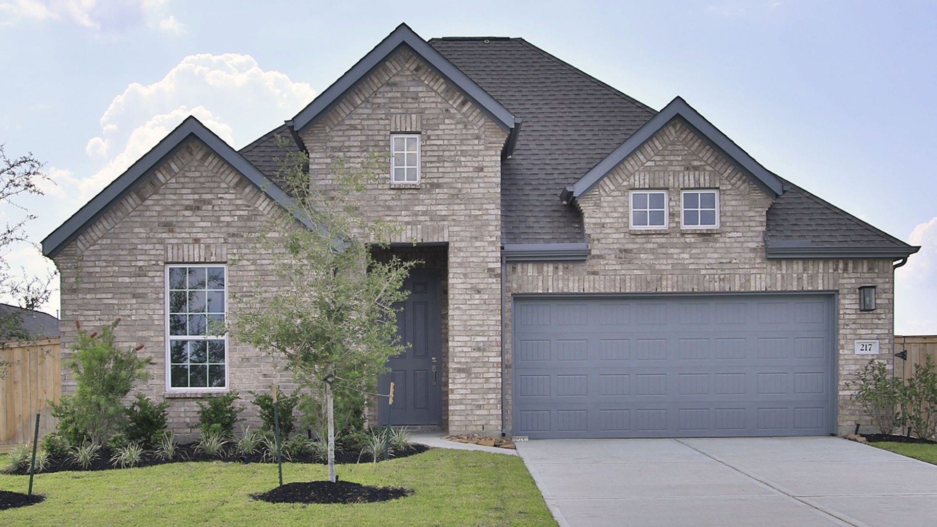 Brick House with Gabled Roof in Willow at River Ranch:Exquisite brick facade with gabled roof and manicured garden in Willow at River Ranch. A touch of luxury.