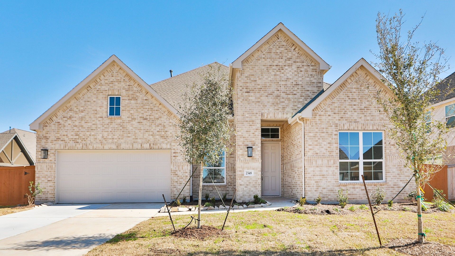 Luxury Brick Home in Tulane at Sunterra:Experience refined living in this exquisite brick facade home in Tulane at Sunterra. Classic elegance meets luxury design.