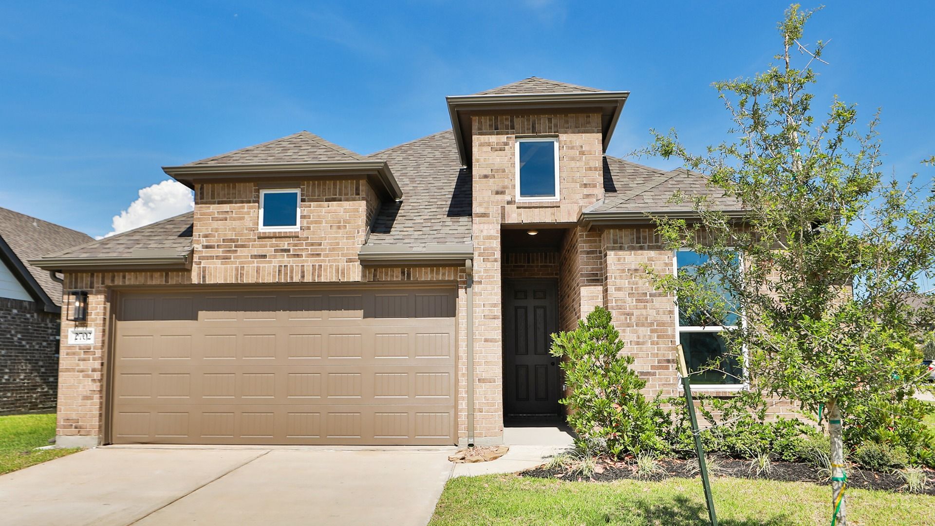 Modern White-Brick Home with Garage in Ellis Cove:Elegant white-brick facade with upscale grey roofing and expansive double garage. Located in Ellis Cove.