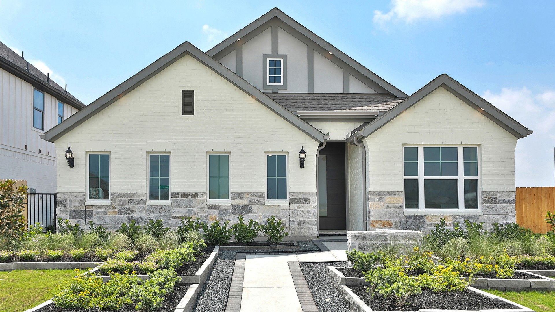 Modern Gabled House in Bridgeland, Texas with Stone Accents:Exquisite gabled home in Bridgeland with pristine stonework and lush landscaping.