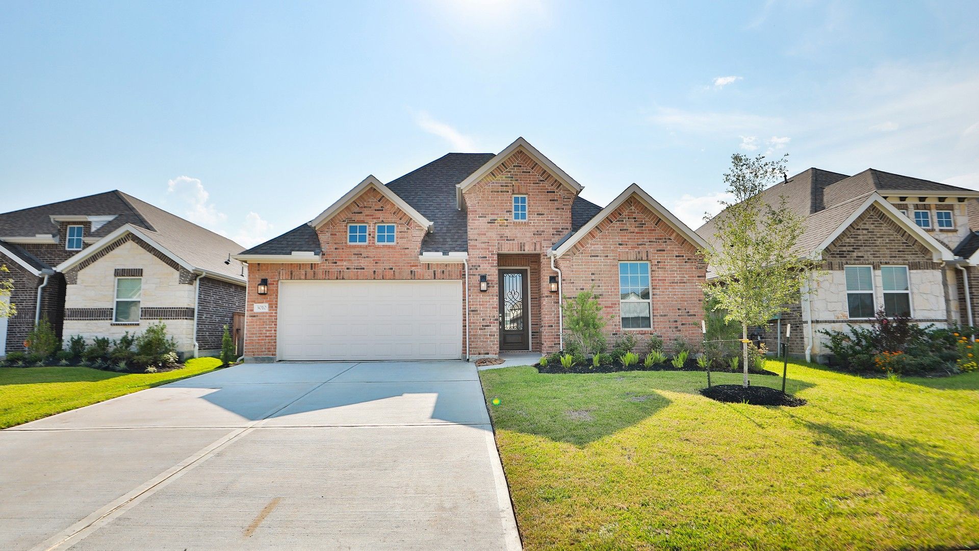 Coastal Point brick home with gabled roof at 3010 Coral Rae Court