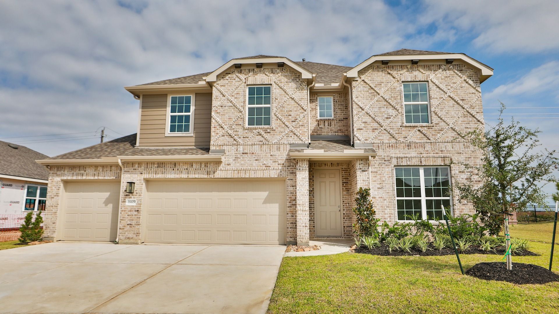 Magnolia at Beamer Villas Luxury Brick House Exterior:Experience refined living with this brick facade and manicured garden at Magnolia, Beamer Villas. Iconic elegance.