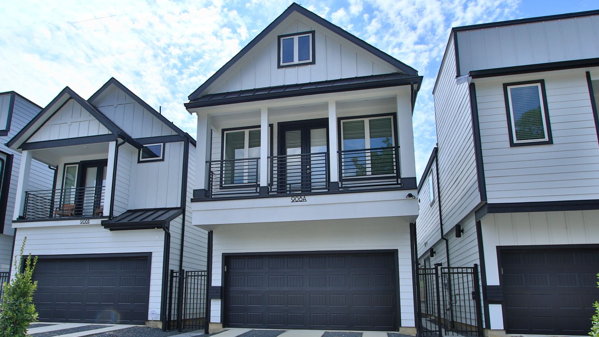 Modern Three-Story Detached Townhome in Shady Acres with Balcony and Garage:Luxurious Shady Acres deatched townhome featuring expansive balcony, and sleek geometric design.