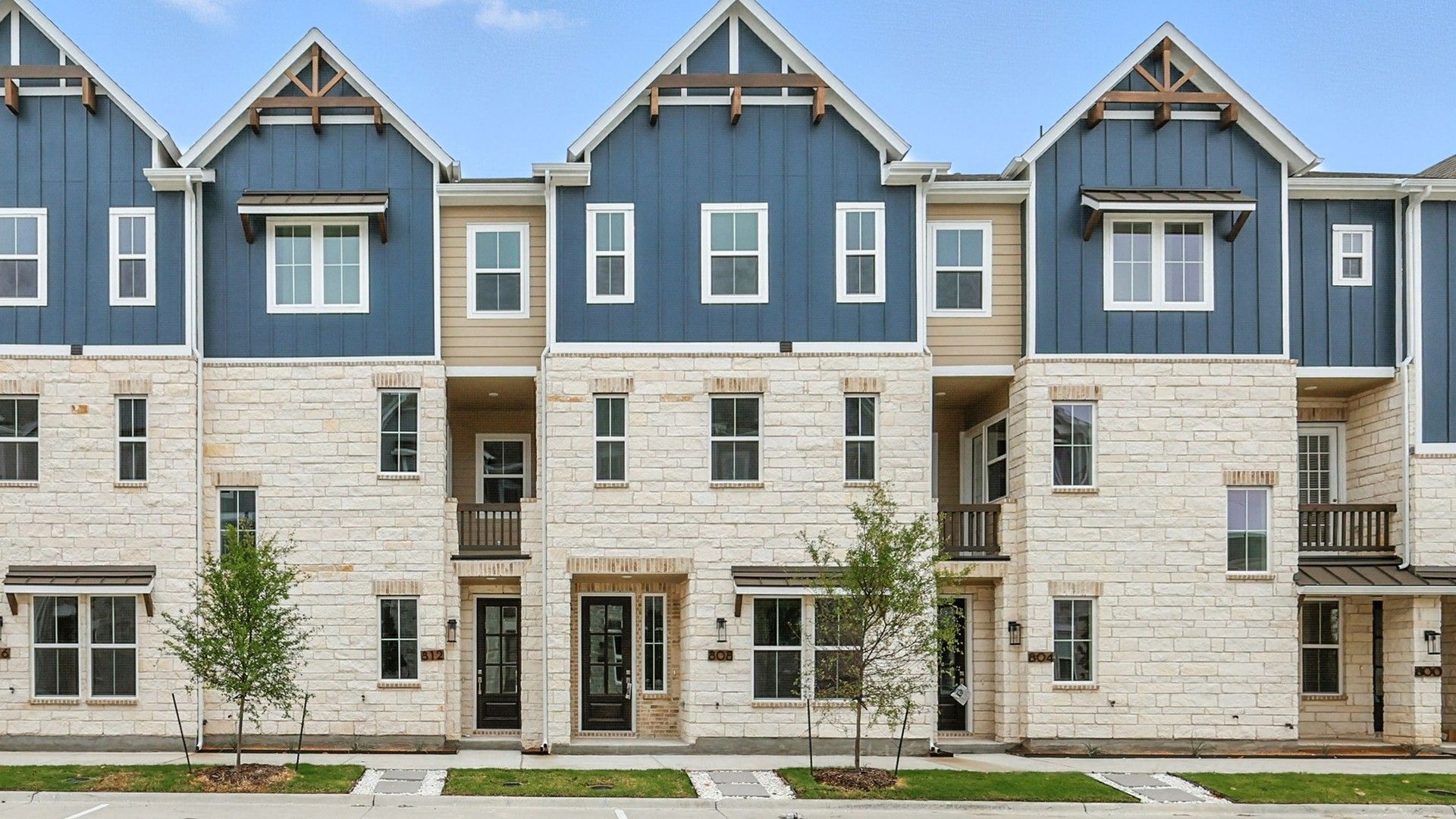 Elegant Townhome Exterior at 812 Concan Drive, Collin Creek:Sophisticated stone facade and blue siding define this Collin Creek townhome's striking exterior.