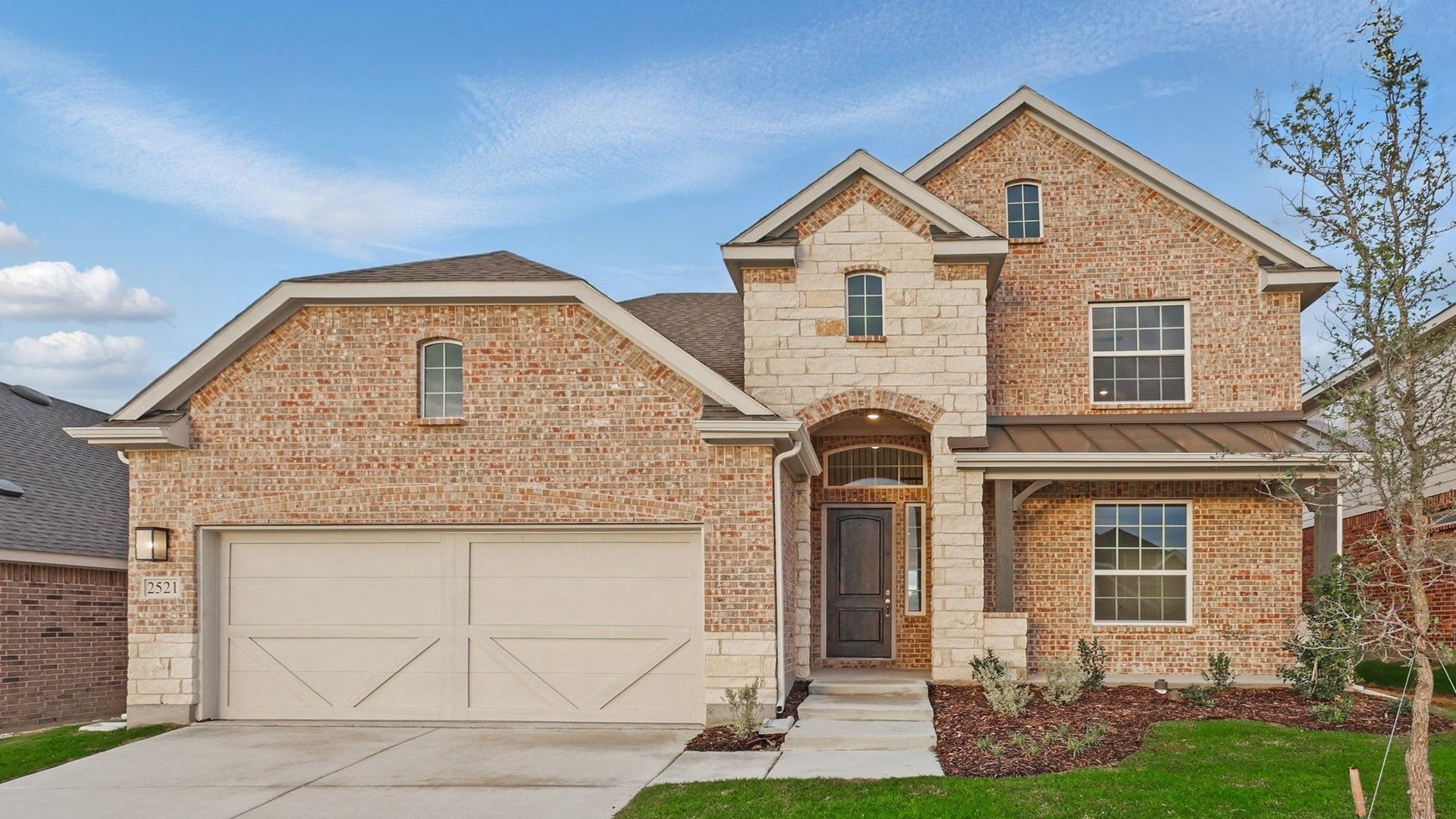 Modern Brick House with Stone Accents and Gable Roof in Suburban Setting:Elegant brick facade with stone detailing and a sleek gable roof, nestled in a picturesque suburban locale.