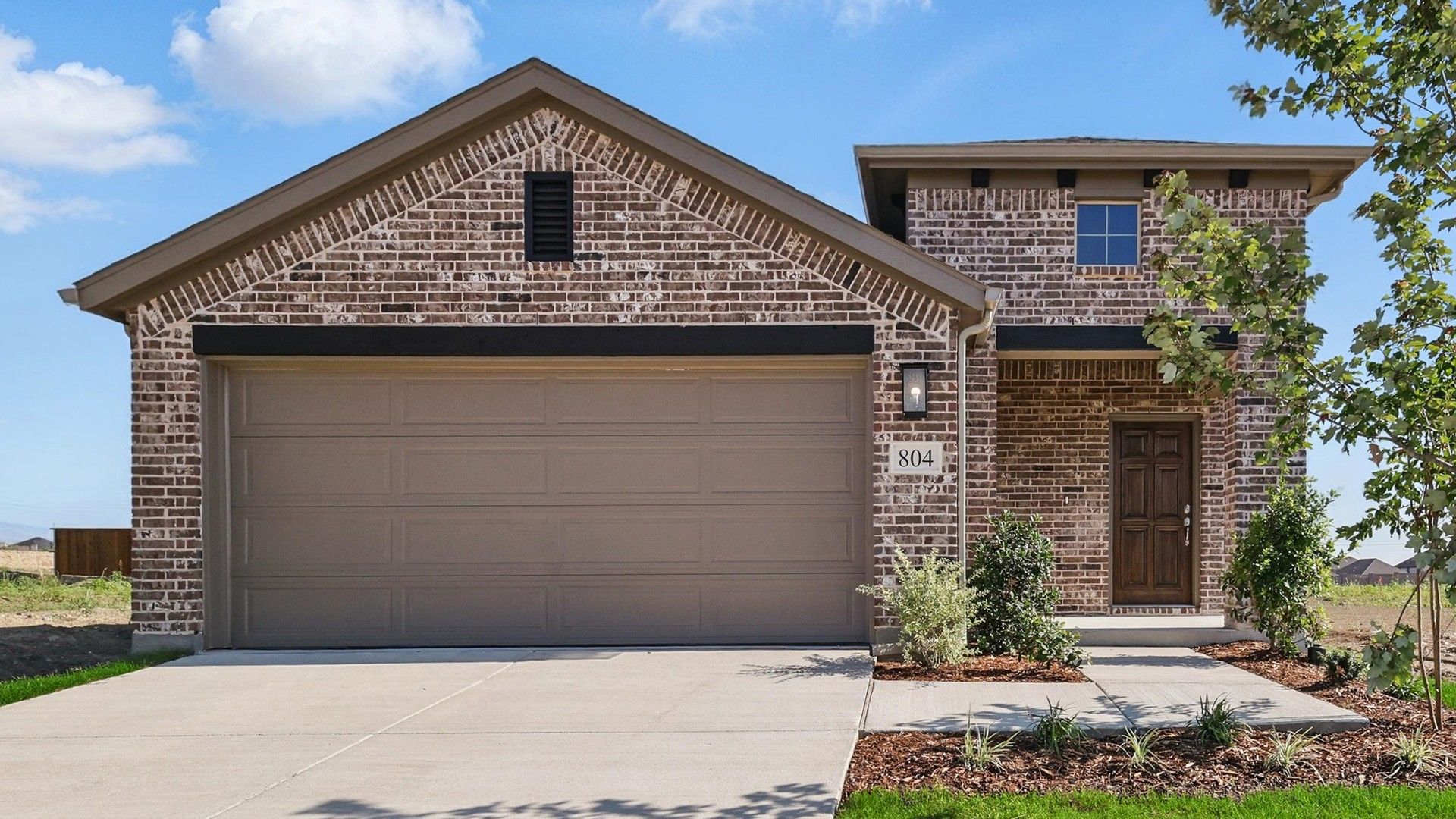 Brick House with Garage and Gabled Roof in Westridge Neighborhood:Elegant brick facade with gabled roof, expansive garage, and refined landscaping in Westridge.