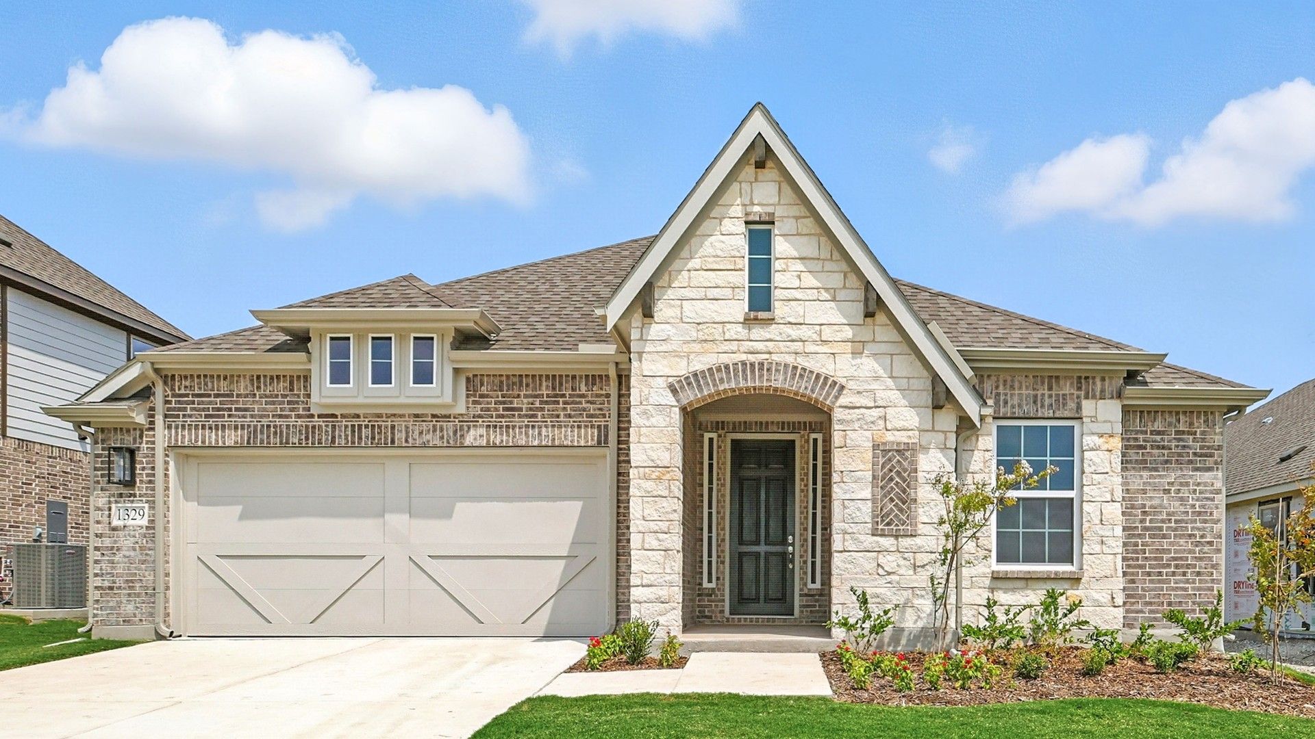 Single-Story Home in Anna Ranch with Stone Facade - 1329 Huntington Drive:Luxurious stone facade and gabled roof highlight this Anna Ranch home at 1329 Huntington Drive.