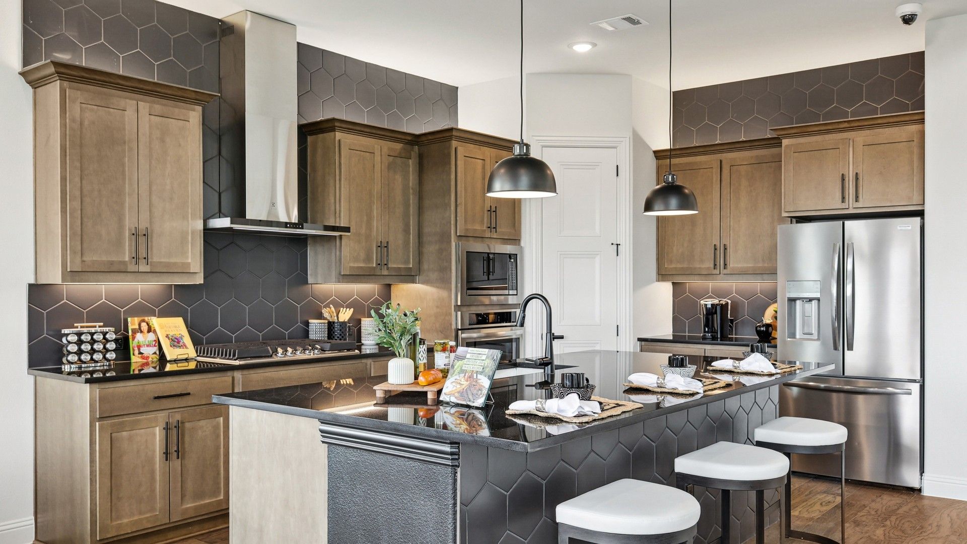 Modern Morningside Kitchen with Hexagonal Tile and Wood Cabinetry:Elegant Morningside kitchen showcases chic hexagonal backsplash and refined wood cabinetry, creating a luxurious ambiance.