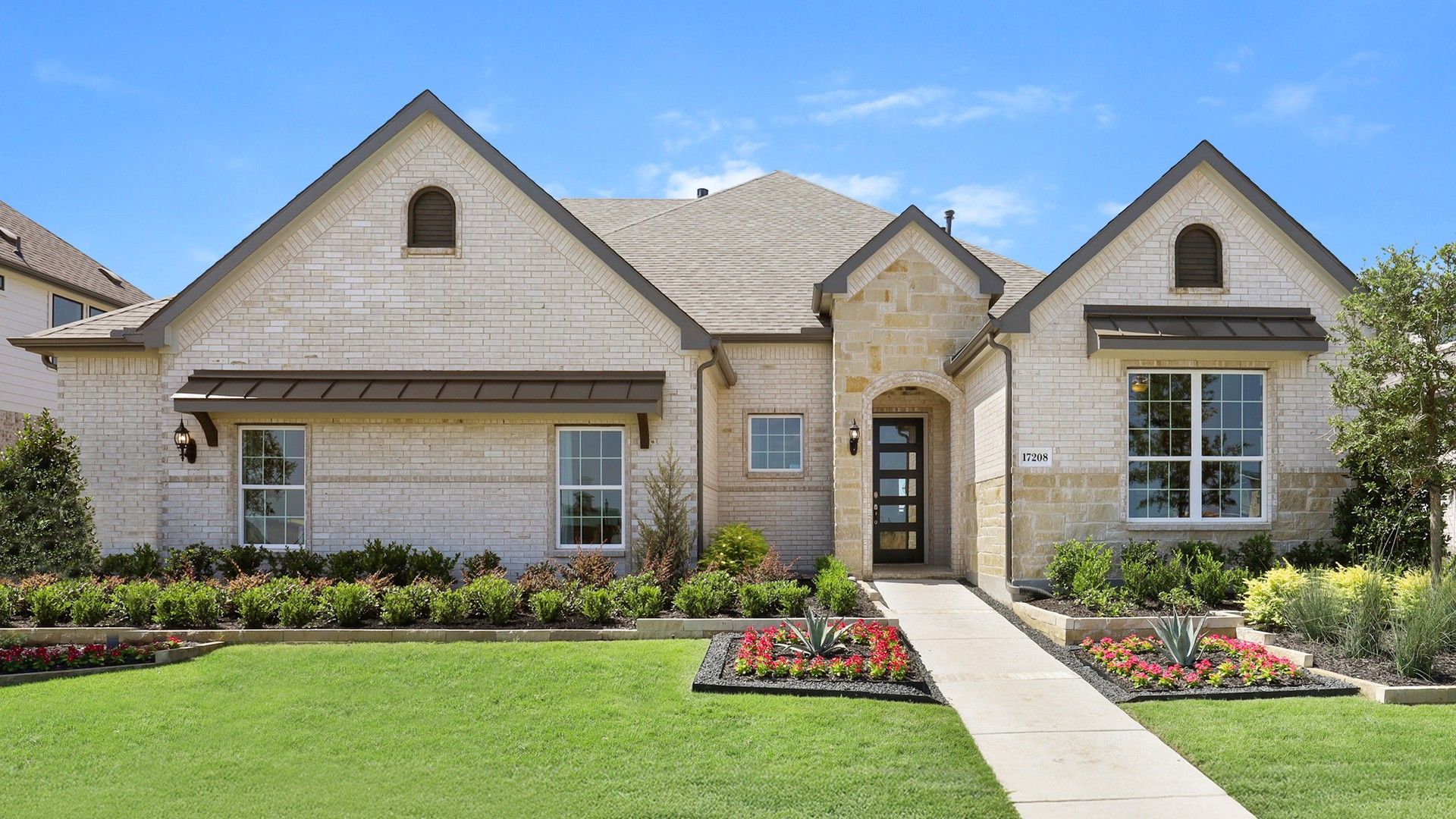 Elegant Brick Home in Lakeshore Bluffs Community:Luxurious arched windows and meticulously landscaped garden in Lakeshore Bluffs.