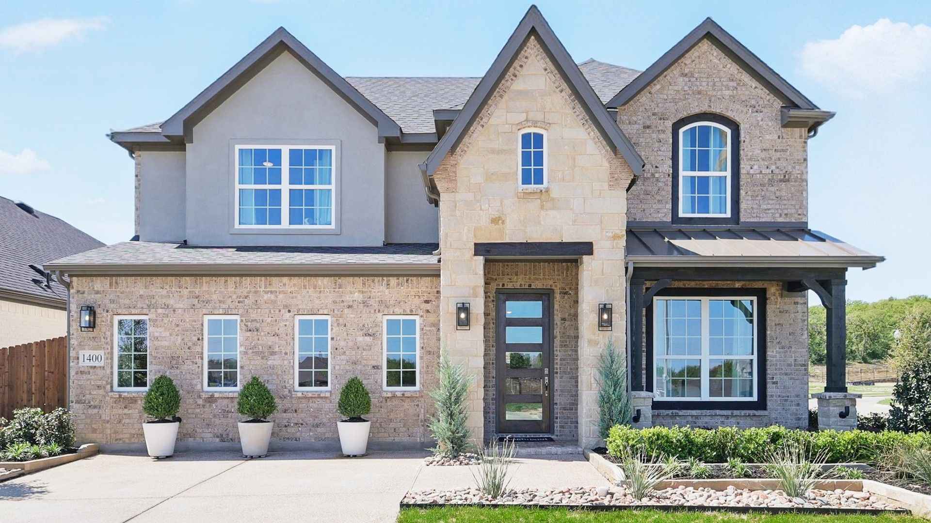 Luxurious Two-Story Brick Home in Green Oaks Preserve Community:Exquisite brick facade and modern gabled architecture in prestigious Green Oaks Preserve.