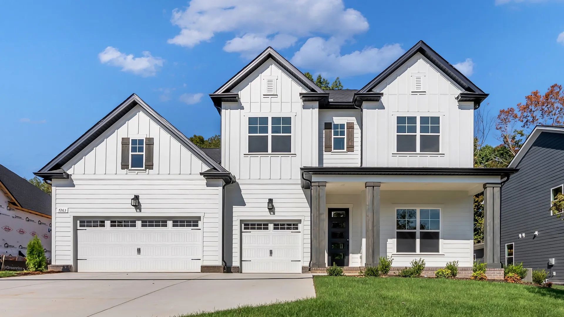 Elegant Two-Story Home with Black Accents in Roan at Brush Creek:Luxurious house with timeless design, black accents, and pristine landscaping in Roan at Brush Creek.