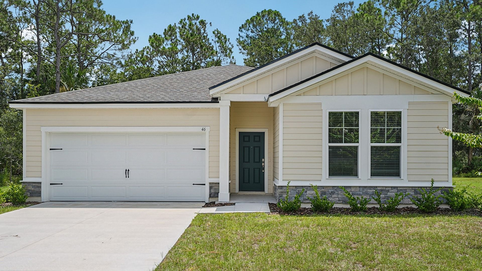 Palm Coast Modern Single-Family Home with Garage and Stone Accents:Elegant stone accents and pristine façade enhance this Palm Coast residence, offering refined curb appeal.