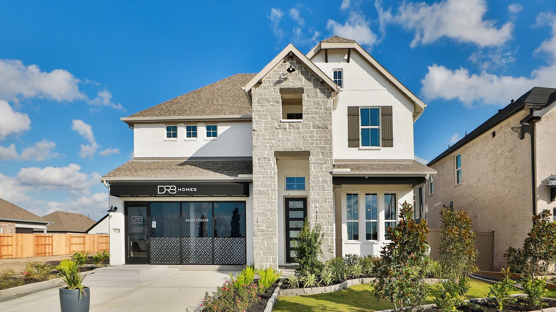 Creekhaven Community Brick Home with Stone Accents Representative Elevation:Stunning Creekhaven home with elegant brickwork, pristine stone features, and expansive windows.