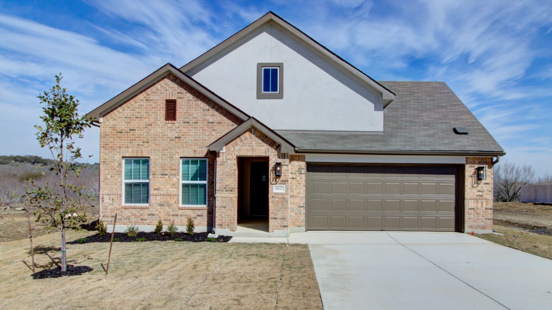 960 Tornado Ridge - 1 of 37.jpeg:Exterior of 960 Tornado Ridge, featuring brick and stucco.