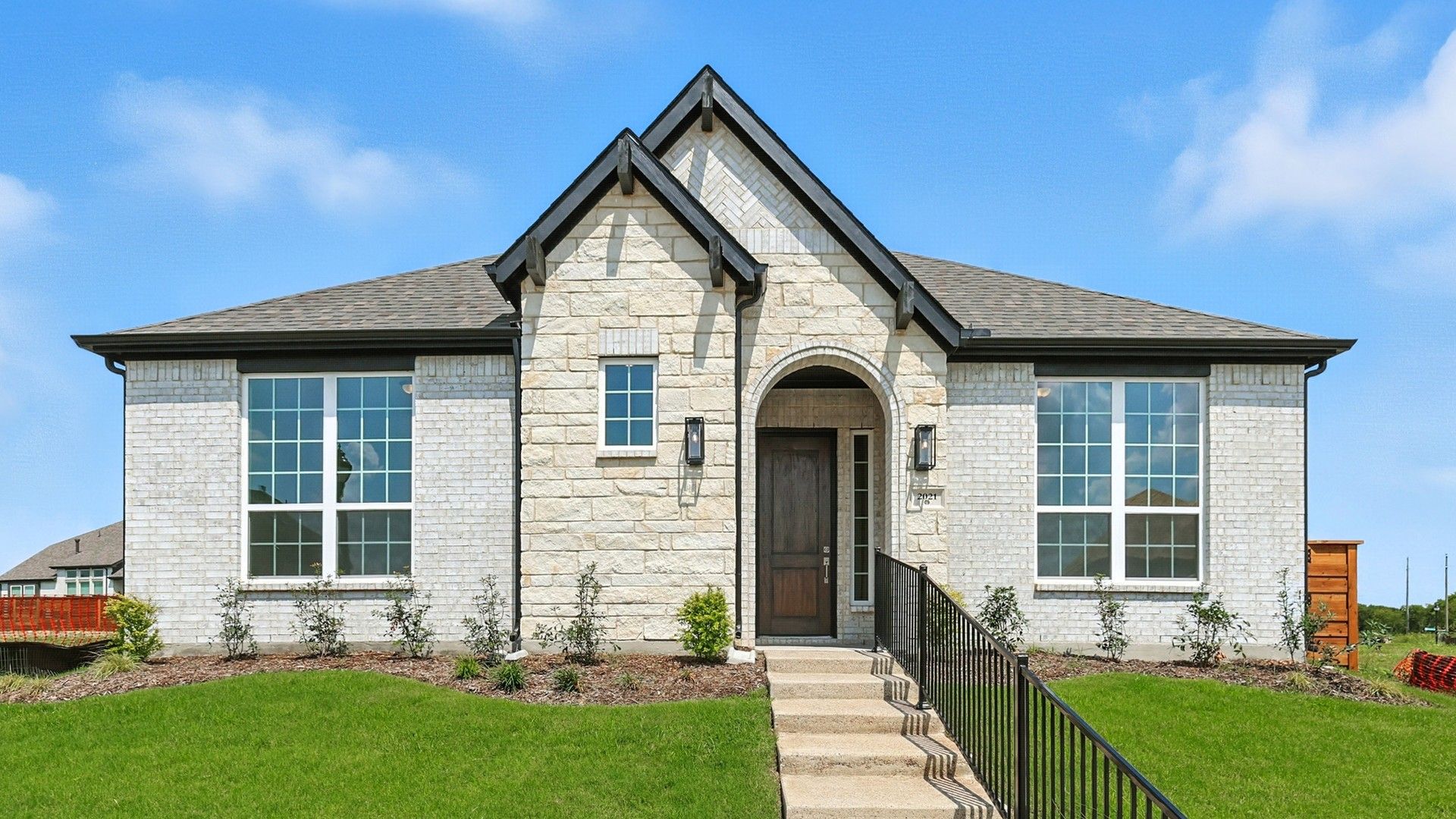 Manor - Charleston Floor Plan Home in Solterra Texas at 2021 Jasper Meadow:Stunning stone facade and expansive windows define this luxury Solterra Texas residence.