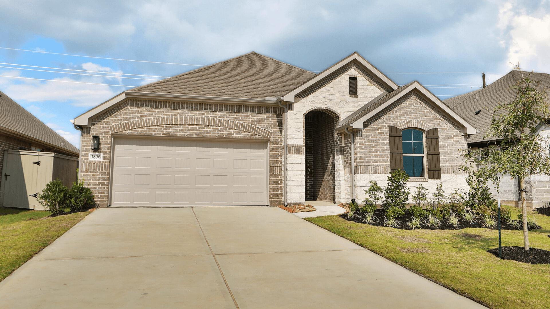 Westland Ranch Brick Home with Garage and Landscaping:Elegant Westland Ranch home showcases refined brickwork, custom shutters, and lush landscaping, offering timeless allure.