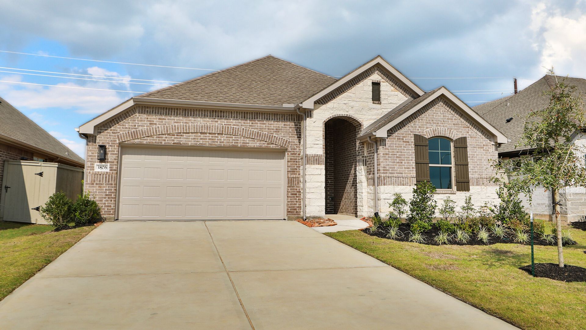 Westland Ranch Brick Home with Garage and Landscaping:Elegant Westland Ranch home showcases refined brickwork, custom shutters, and lush landscaping, offering timeless allure.