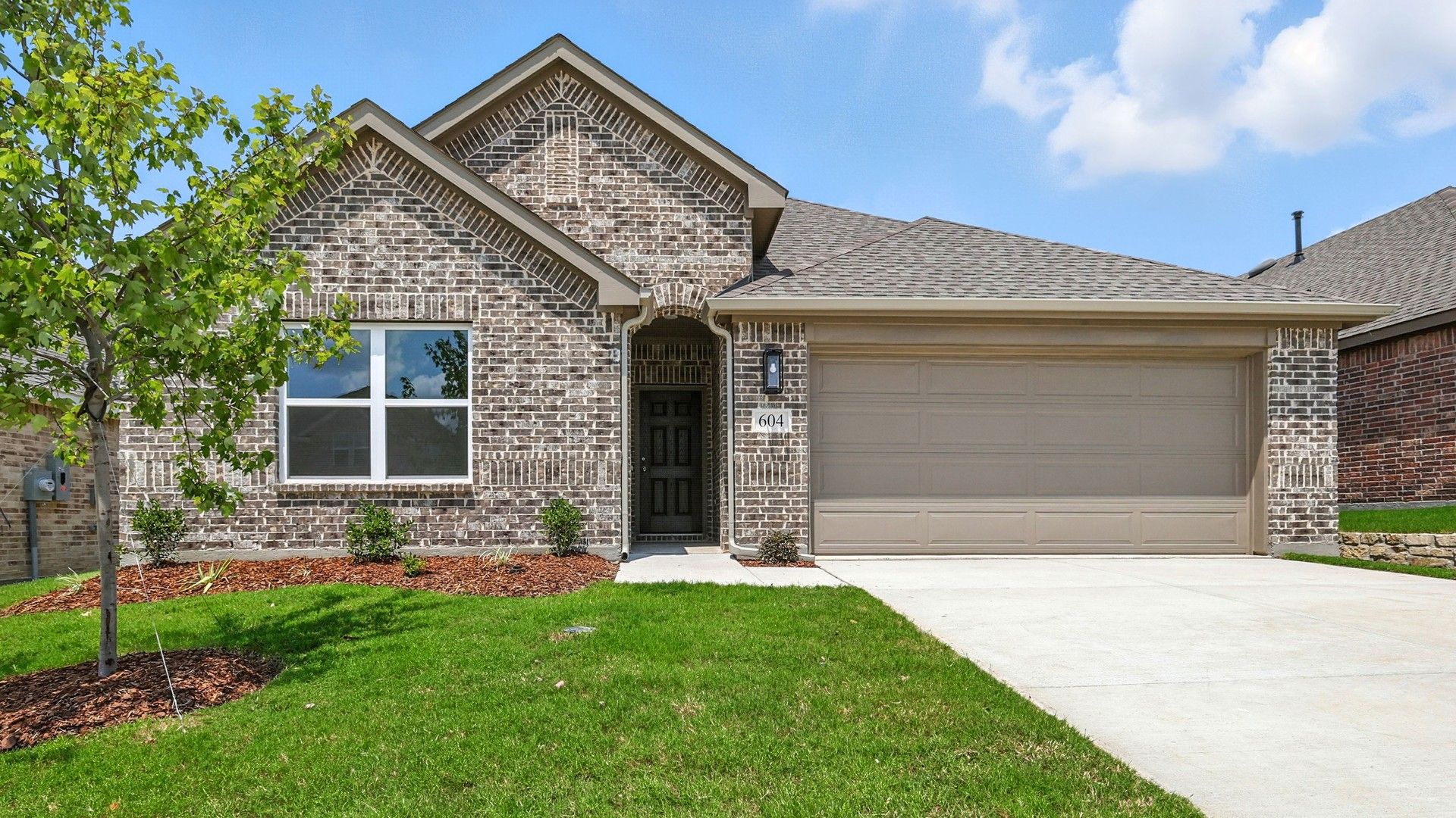 Brick Home in Simpson Crossing with Modern Garage:Elegant single-story brick facade with exquisite gable detail and modern garage in Simpson Crossing.