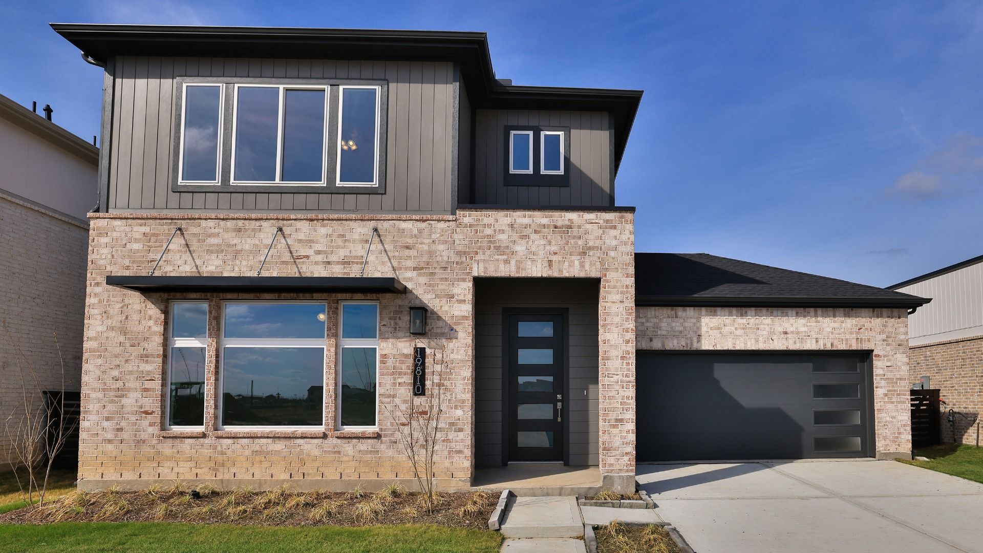 Modern single-family home design with sleek architecture elements:Elevation B