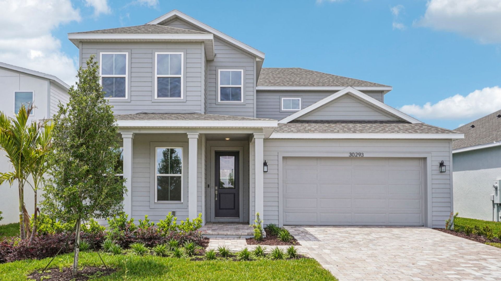 Plumeria Front Exterior:Plumeria Floor Plan Front Exterior Elevation by DRB Homes in Trailside located in Mount Dora, FL