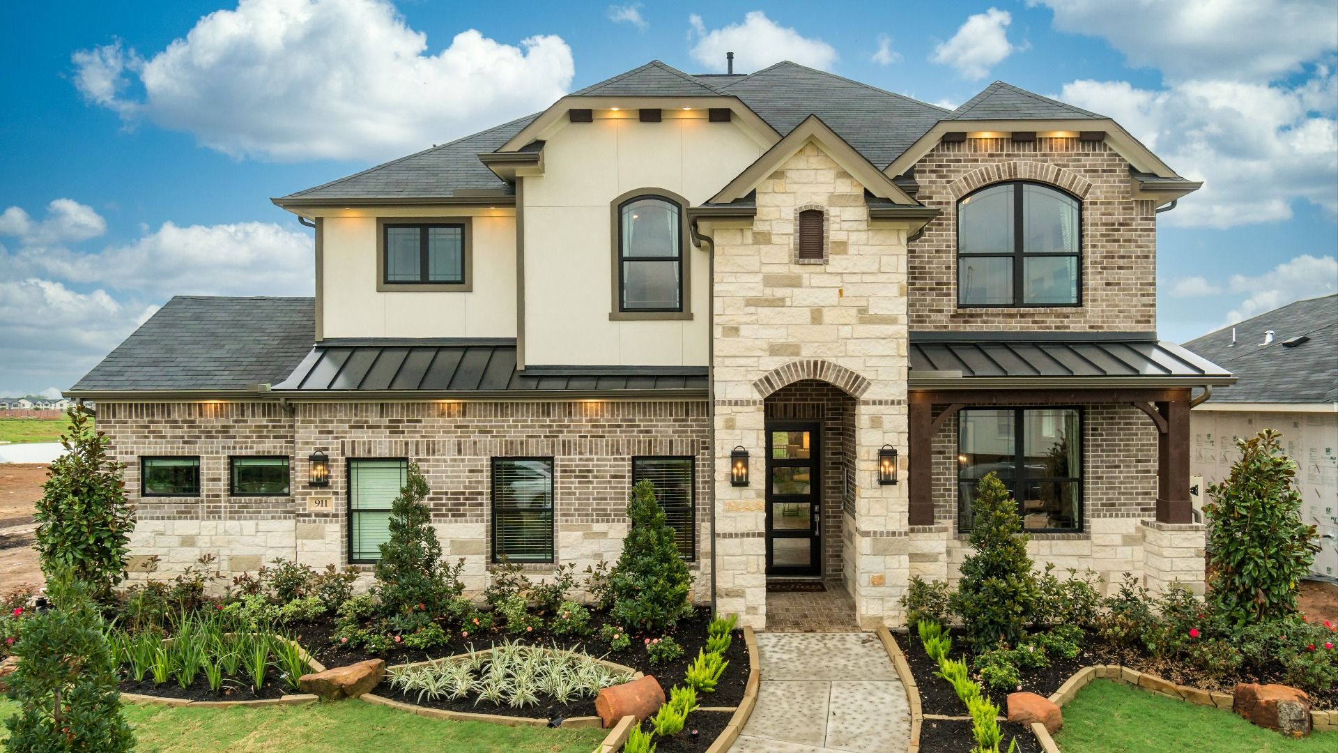 New Waverly Station Magnolia Elevation with 3-car garage