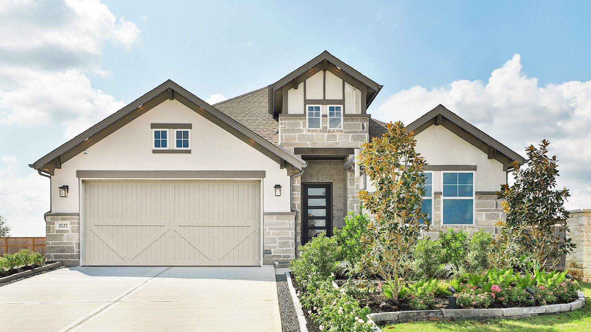 Luxurious Brick Home in Westland Ranch Community by DRB Homes:Brick facade, elegant archway, and lush landscaping define this Westland Ranch home.