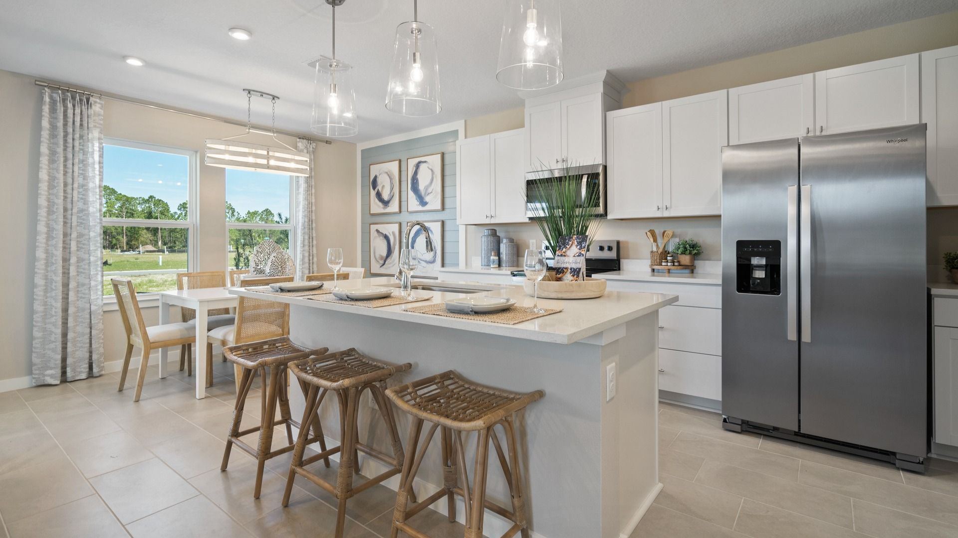 The Coronado Cyrene Harmony Kitchen and Living Room:Cyrene at Harmony by DRB Homes in St. Cloud features an open kitchen and dining space for cooking and entertaining.