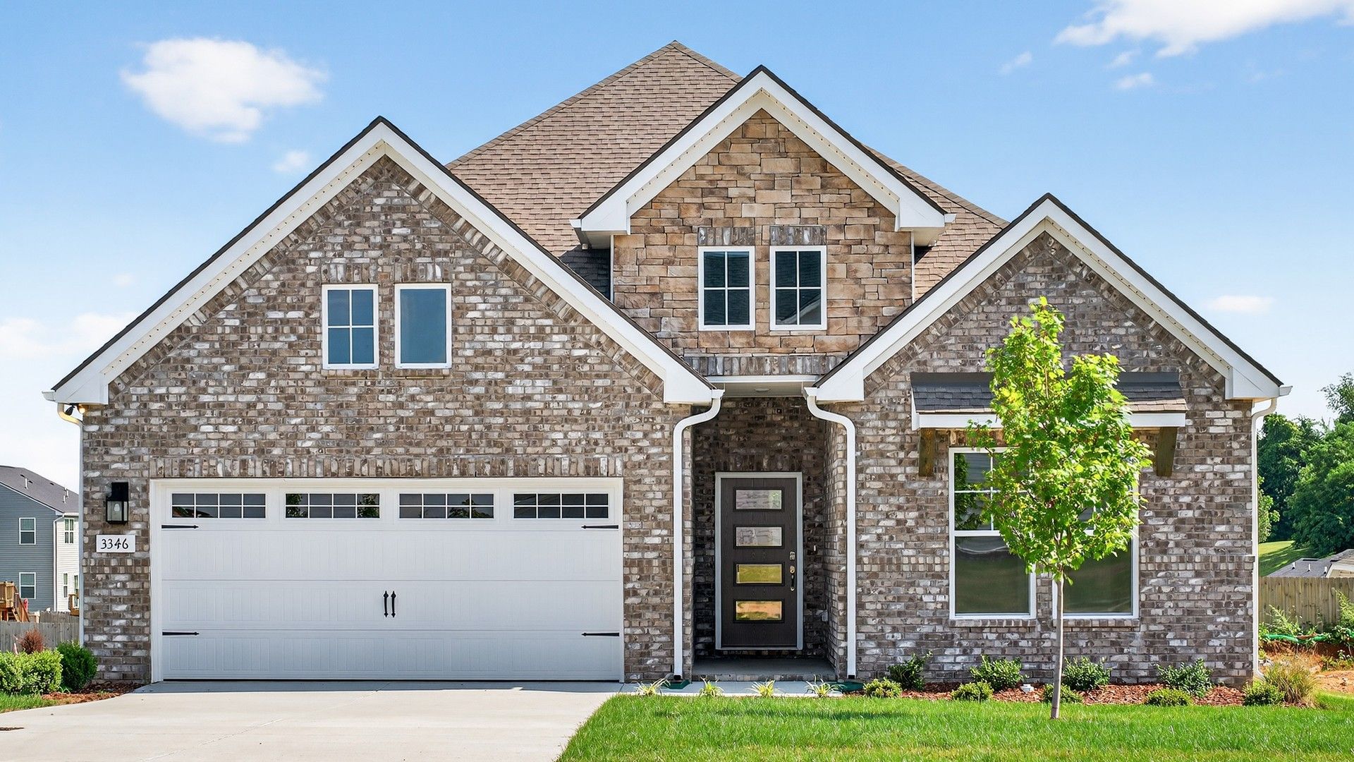 Brick Home with Gabled Roof at Harpeth, McClure Farms:Exquisite brickwork and modern gabled roof design define this Harpeth residence in McClure Farms.