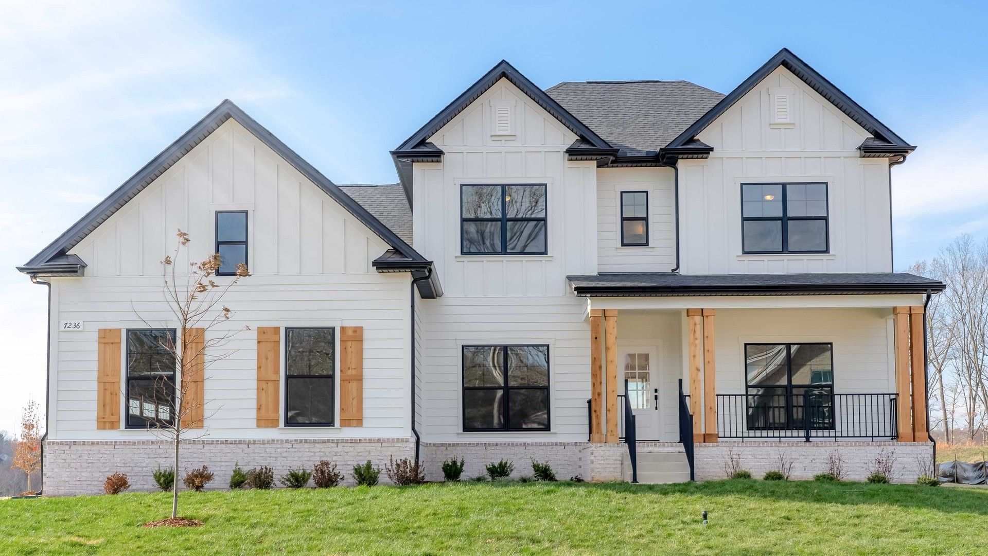 Elegant Two-Story Home in Brush Creek Community with Modern Design:This Brush Creek gem features exquisite board-and-batten siding, chic wooden accents, and a timeless gable roof.