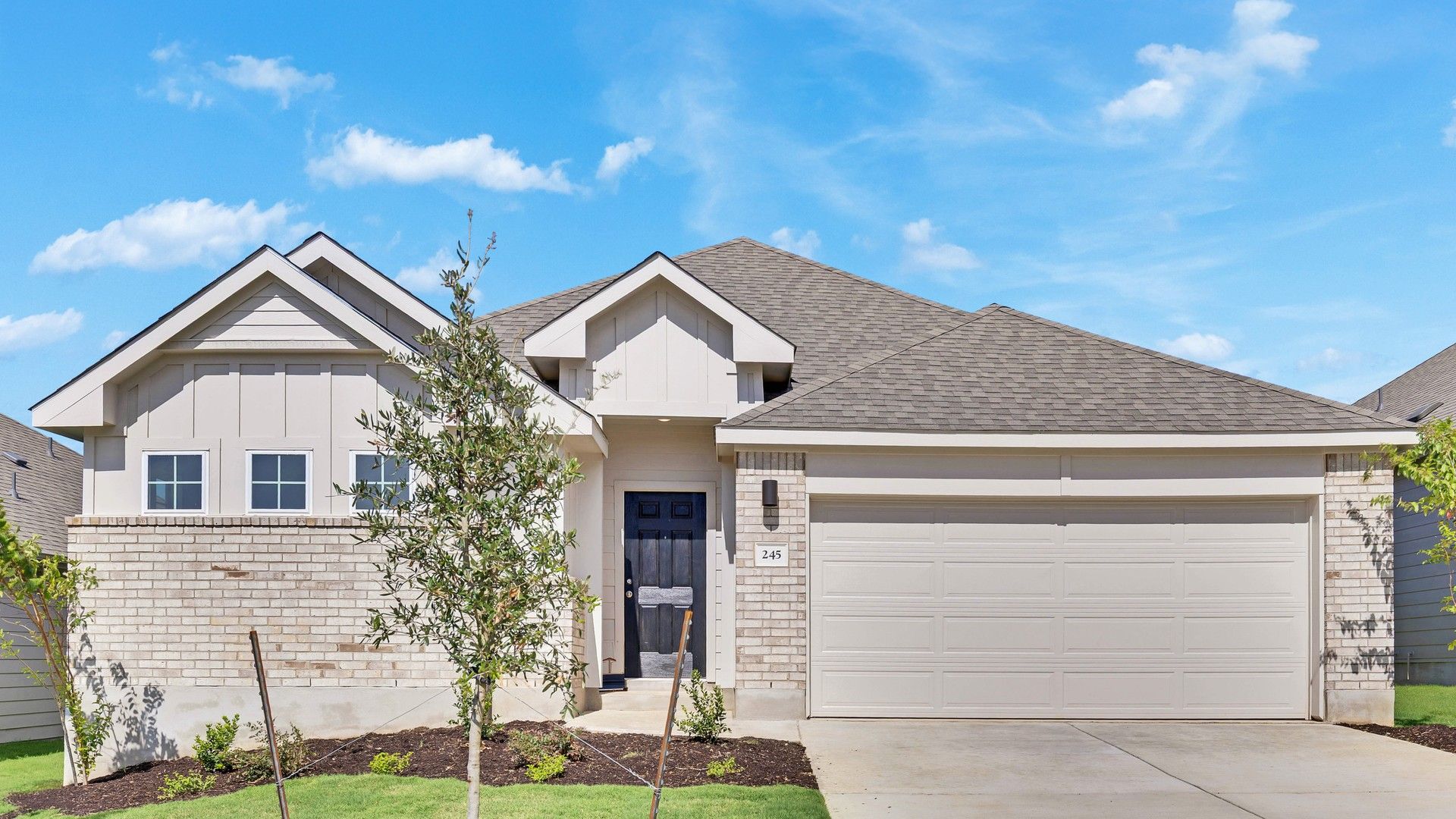 Red Single-Story Home with Gabled Roof in Calumet:Elegant red exterior with exquisite stone facade and gabled roof, nestled in Calumet's prestigious location.