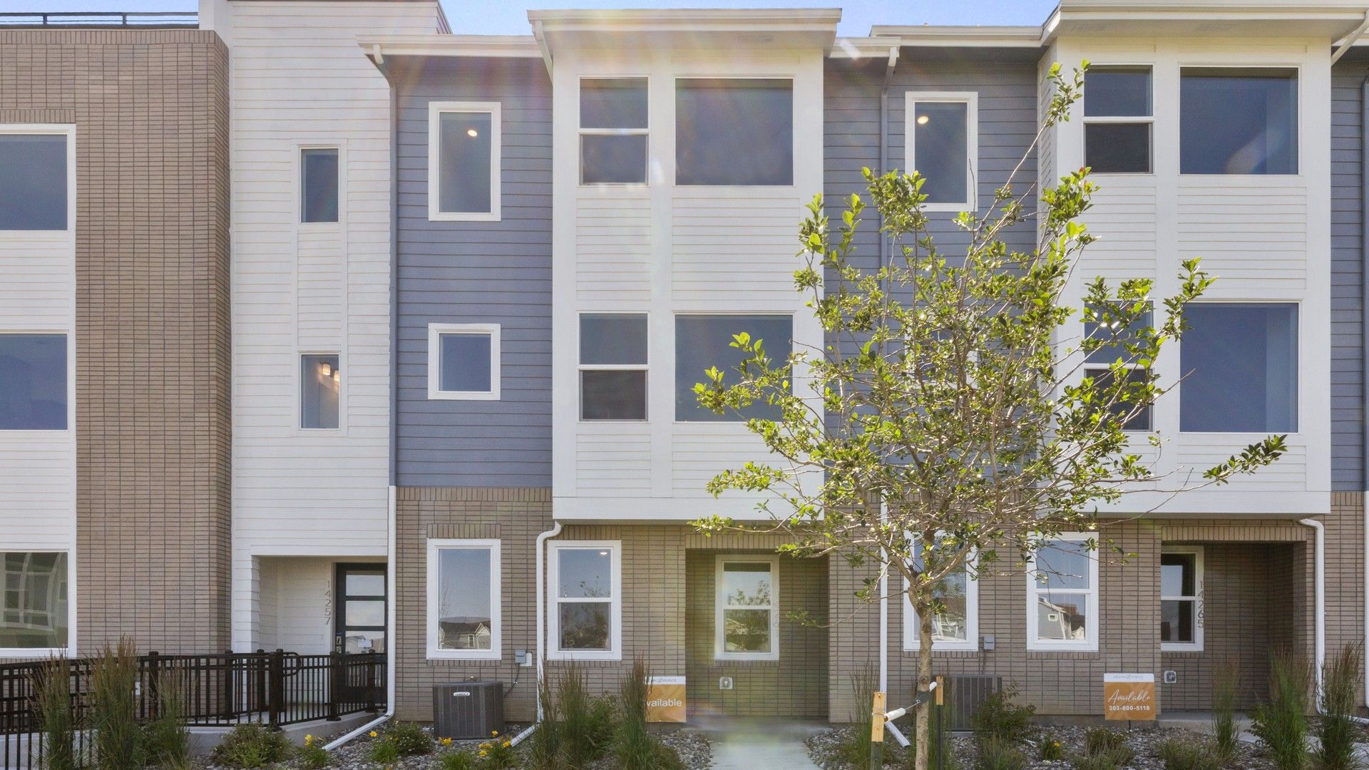 Modern Townhouse Exterior in Dillon Pointe:Exquisite facade with blend of brick and siding, sleek lines, ample windows in Dillon Pointe.