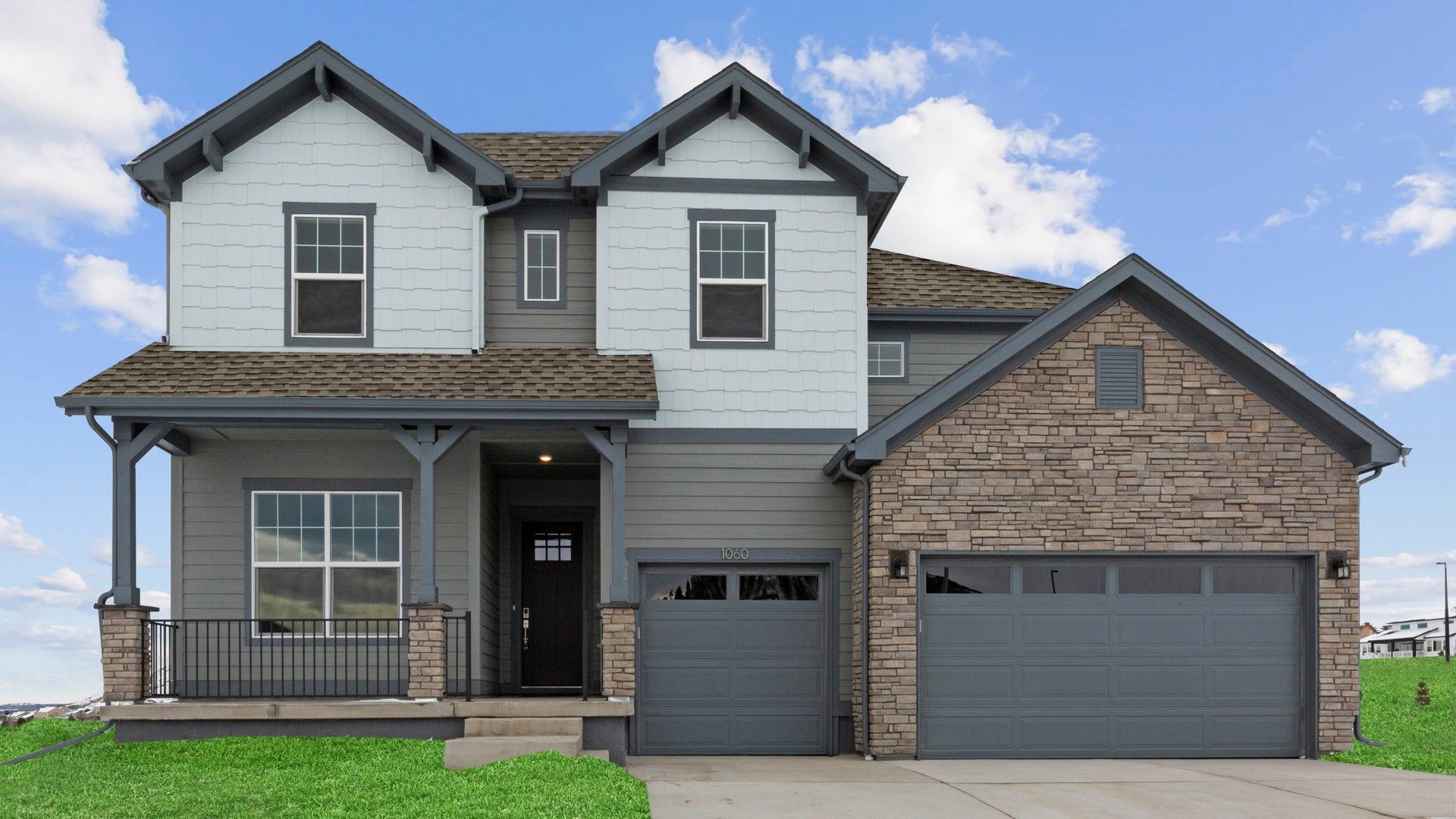 Elegant Two-Story Home in Montaine Community, Colorado:Experience refined living with gabled roofs and stone facade in Colorado's Montaine community.