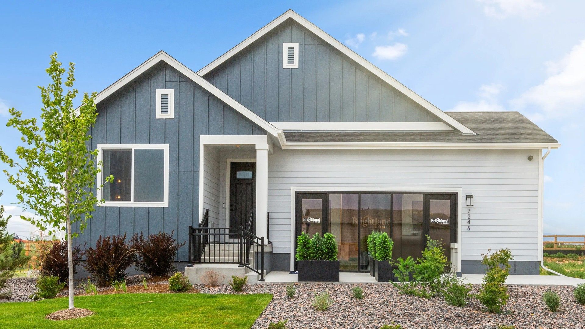 Modern Suburban Home with Gabled Roof in Granary Community:Contemporary gabled design with sleek finishes in scenic Granary community. Meticulous landscaping enhances curb appeal.