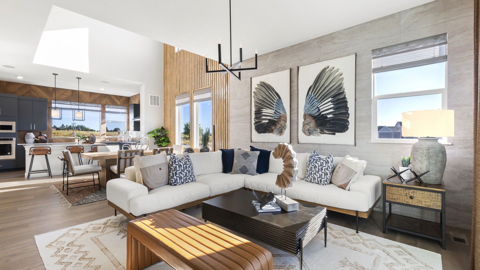 Modern Living Room with Open Kitchen at Dillon Pointe:Experience luxury in Dillon Pointe's open space featuring elegant wood accents and high-end natural lighting.