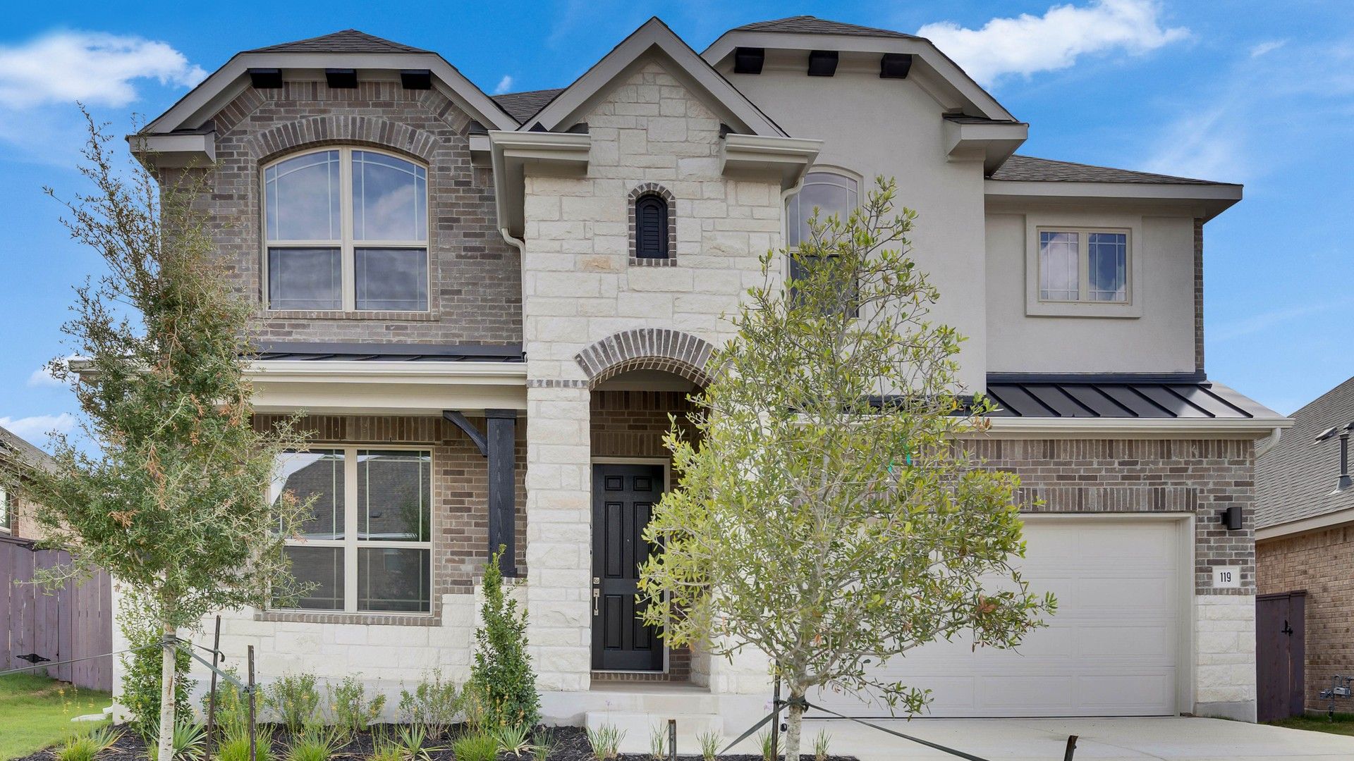 Premier Magnolia home at 119 Douglass Way in Anthem community.:Elegant stone facade and arched entry define this Anthem home at 119 Douglass Way.