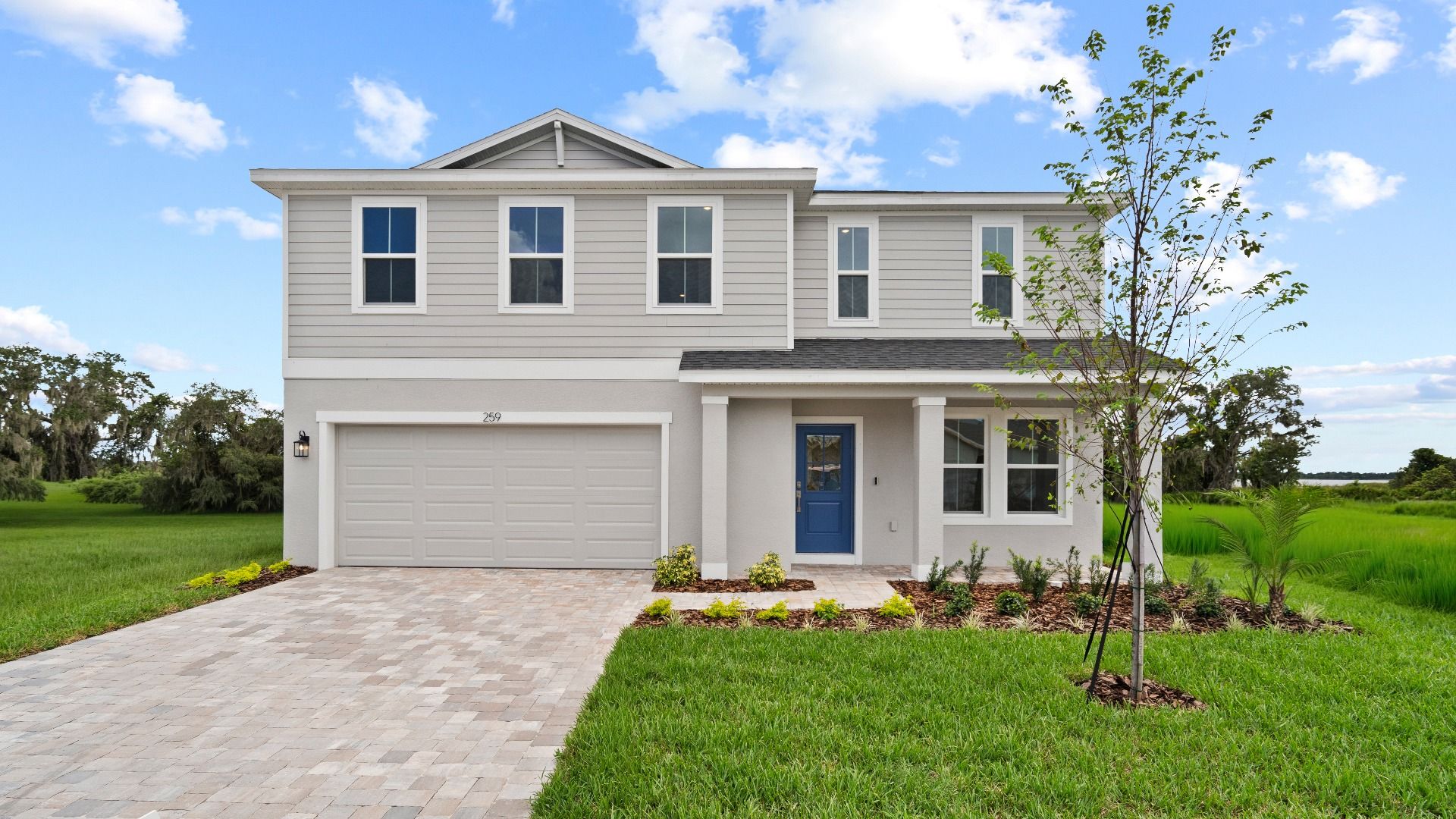 Highbourne Front Exterior:Highbourne Elevation by DRB Homes in Willowbrook North located on Lake Fannie in Winter Haven, FL.