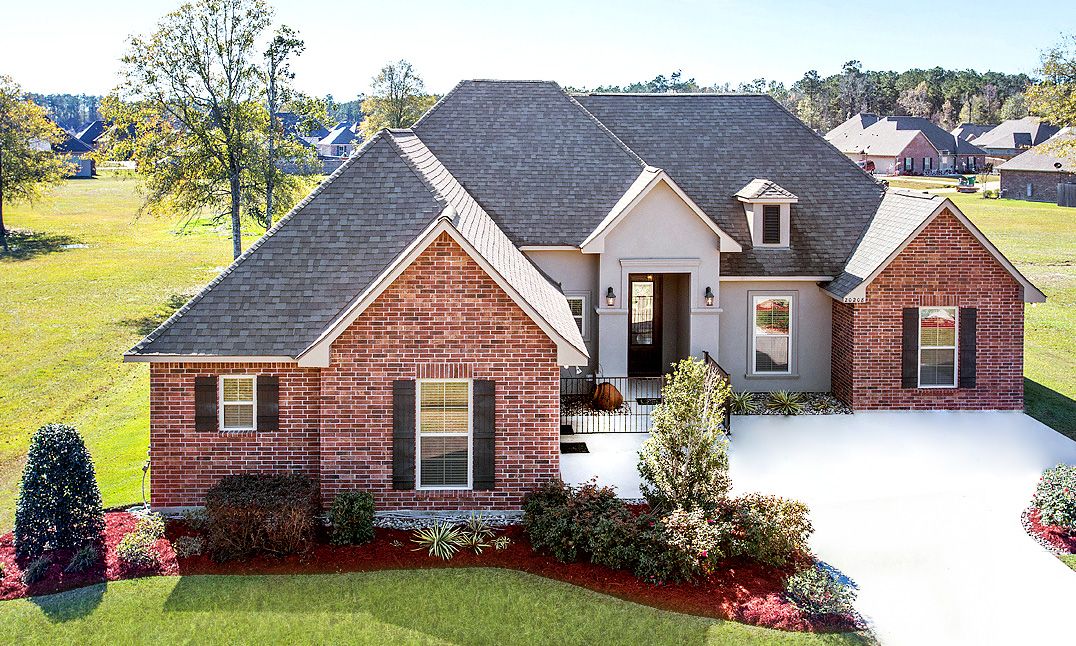 Front of Model Home- Brick- Stucco- side loading garage- Hammond Area- DSLD Homes- Hammond- Louis...