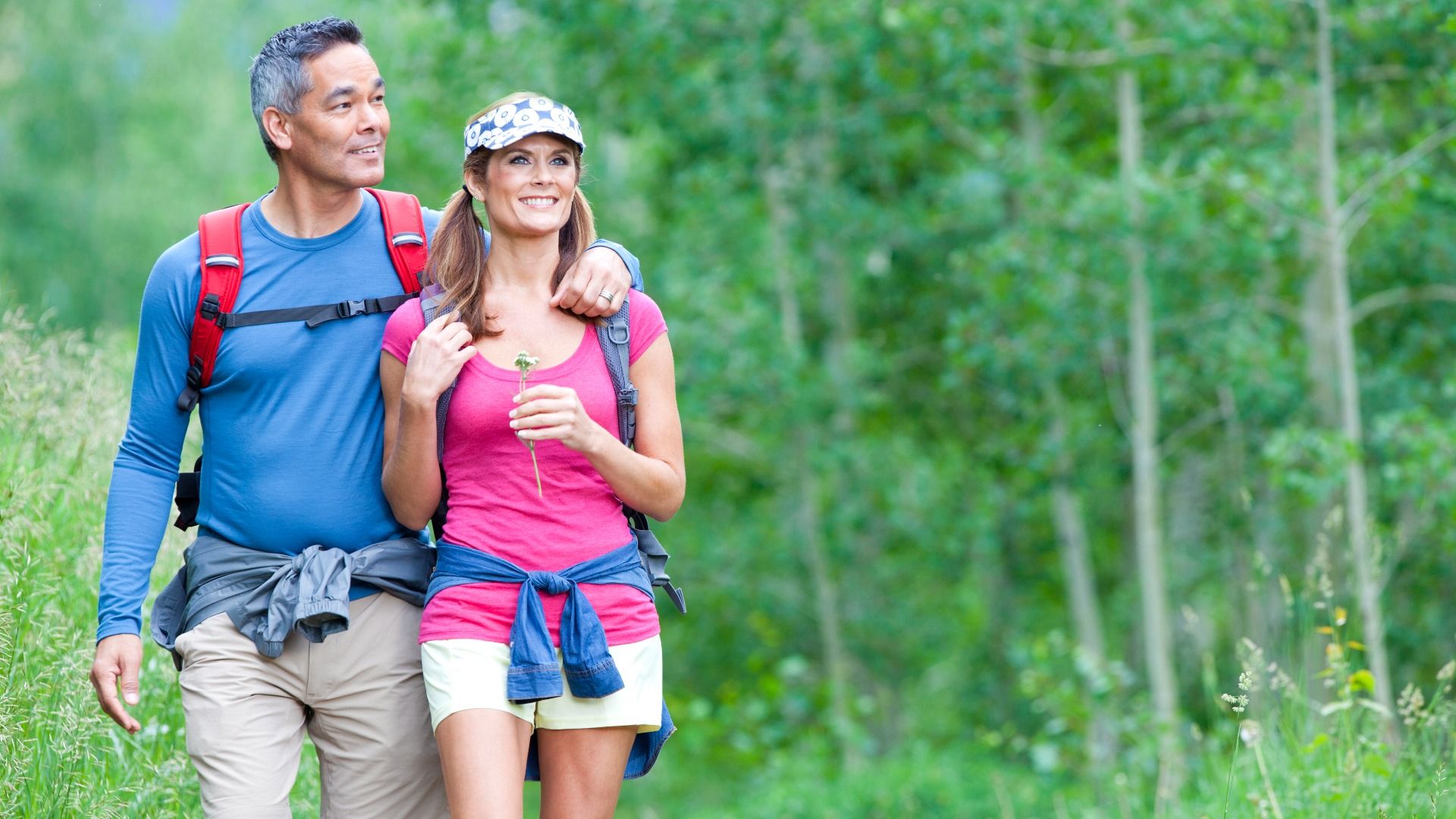 Couple hiking in the woods:Couple enjoying a hike in the woods