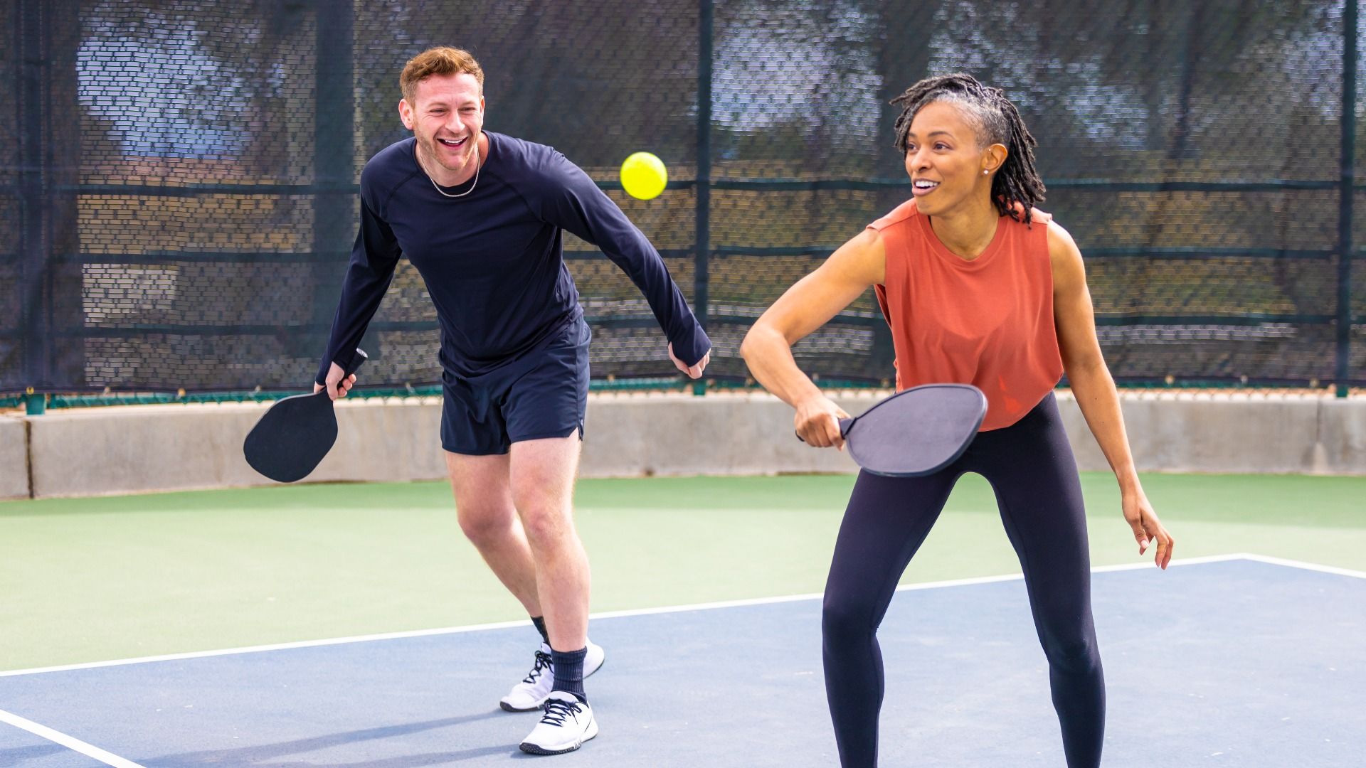 People having fun while playing Pickleball