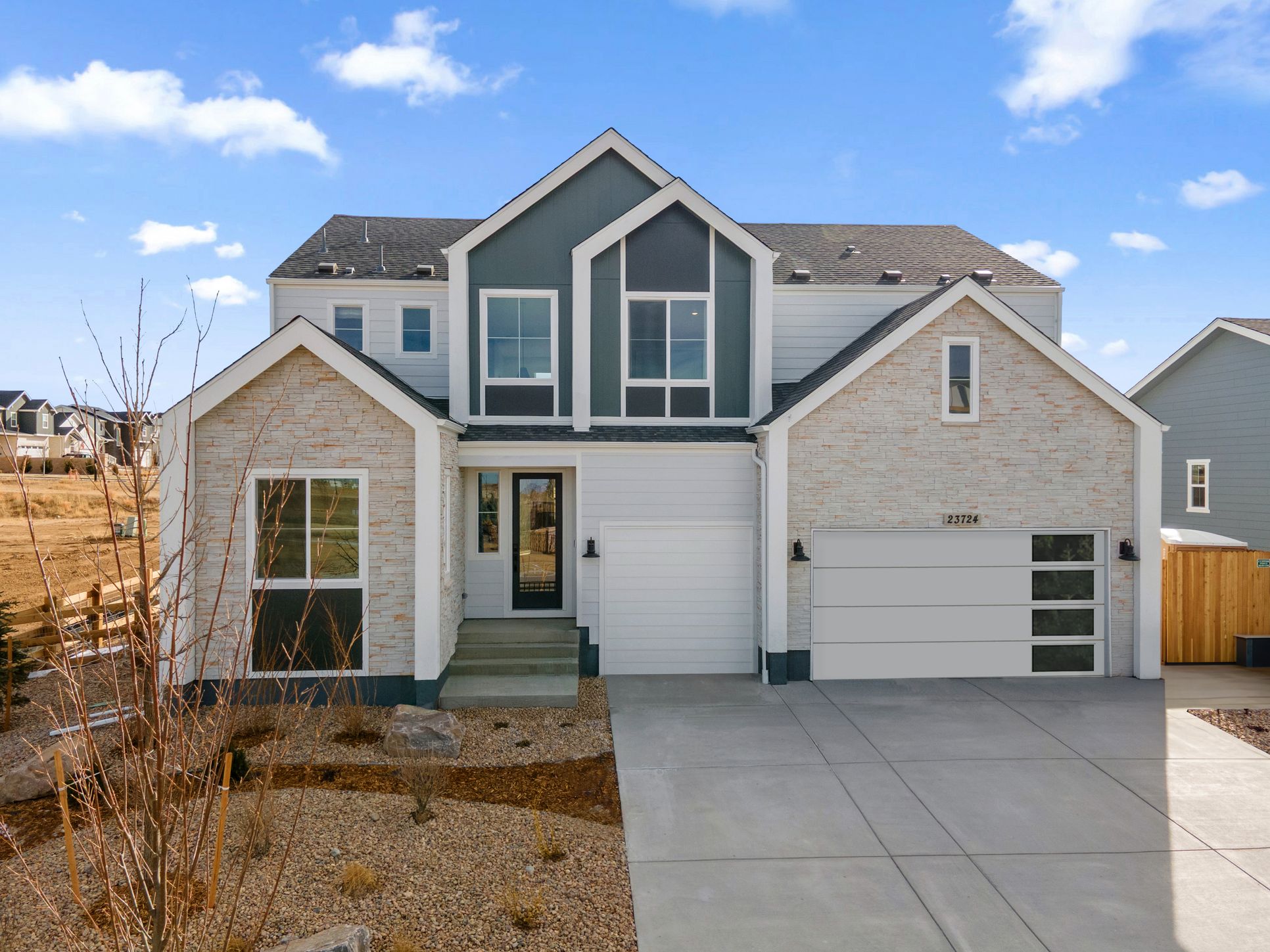 The Aurora Highlands - Plan 4904 - Front Exterior - Model Photography - Risewell Homes