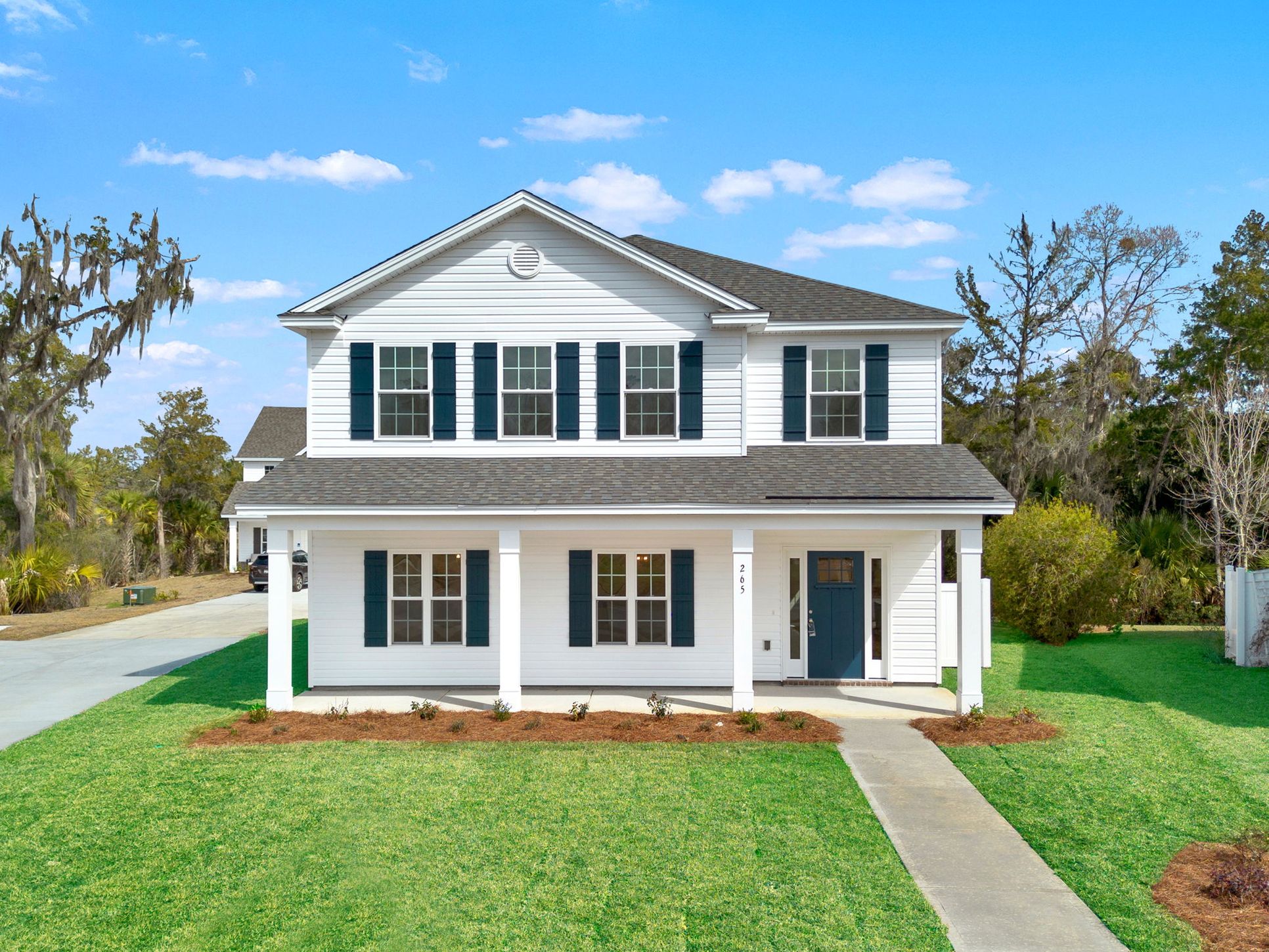 The two-story Aspen home plan by Ernest Homes at 265 James Drive, featuring a full-width covered ...:265 James Drive - Aspen Plan Front Elevation