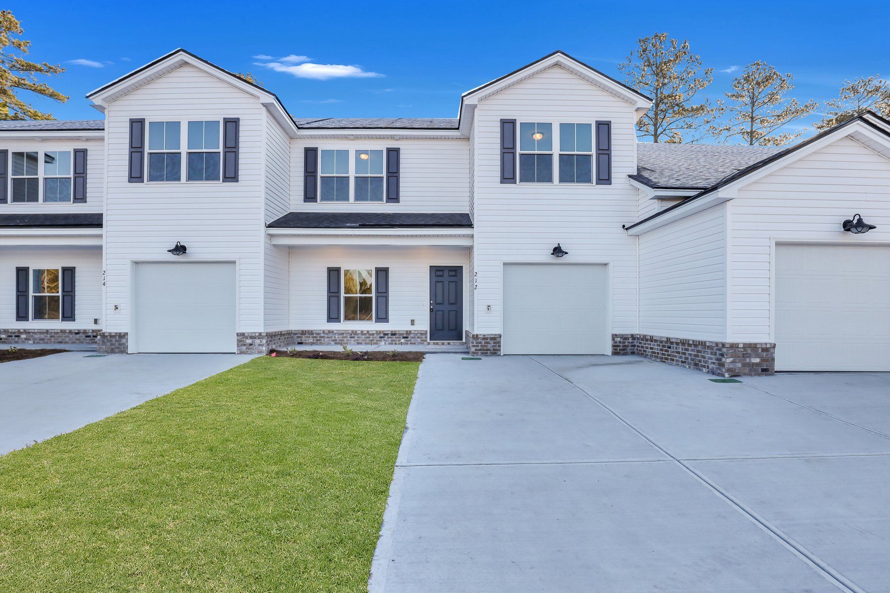 New Haven Townhome B plan exterior front view in Guyton, GA community:New Haven Townhome B - Front Elevation | Ernest Homes