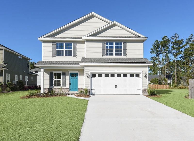 Front exterior view of the Hatteras Signature D with two-story design covered entry. Richmond Hil...:Hatteras Signature Elevation D – Exterior Front View | Ernest Homes
