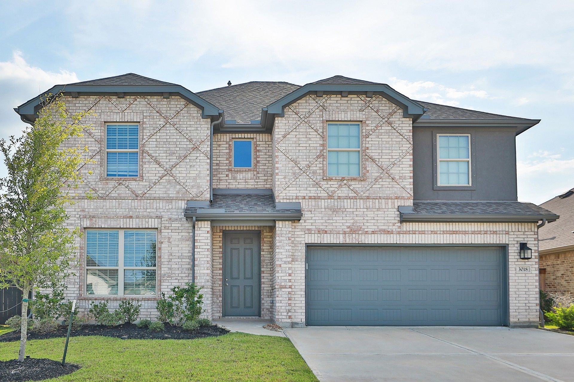 Two-story brick home in Coastal Point at 3018 Myrtle Beach Lane.:Stunning brick facade and modern design at 3018 Myrtle Beach Lane in Coastal Point.