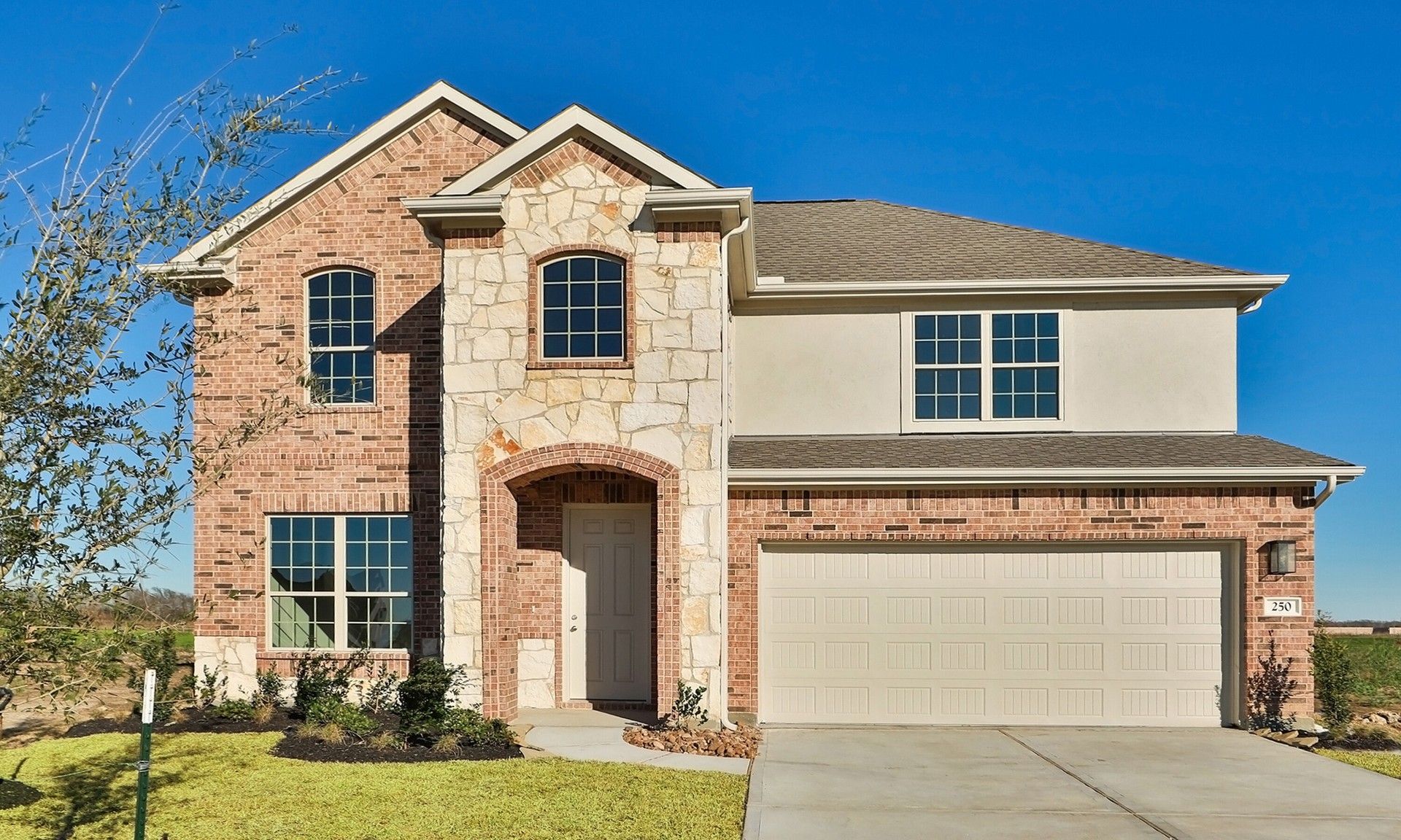 Elegant Two-Story Brick Home at Rosewood River Ranch:Discover elevated living in Rosewood. A striking brick façade and elegant archway define this exquisite residence.