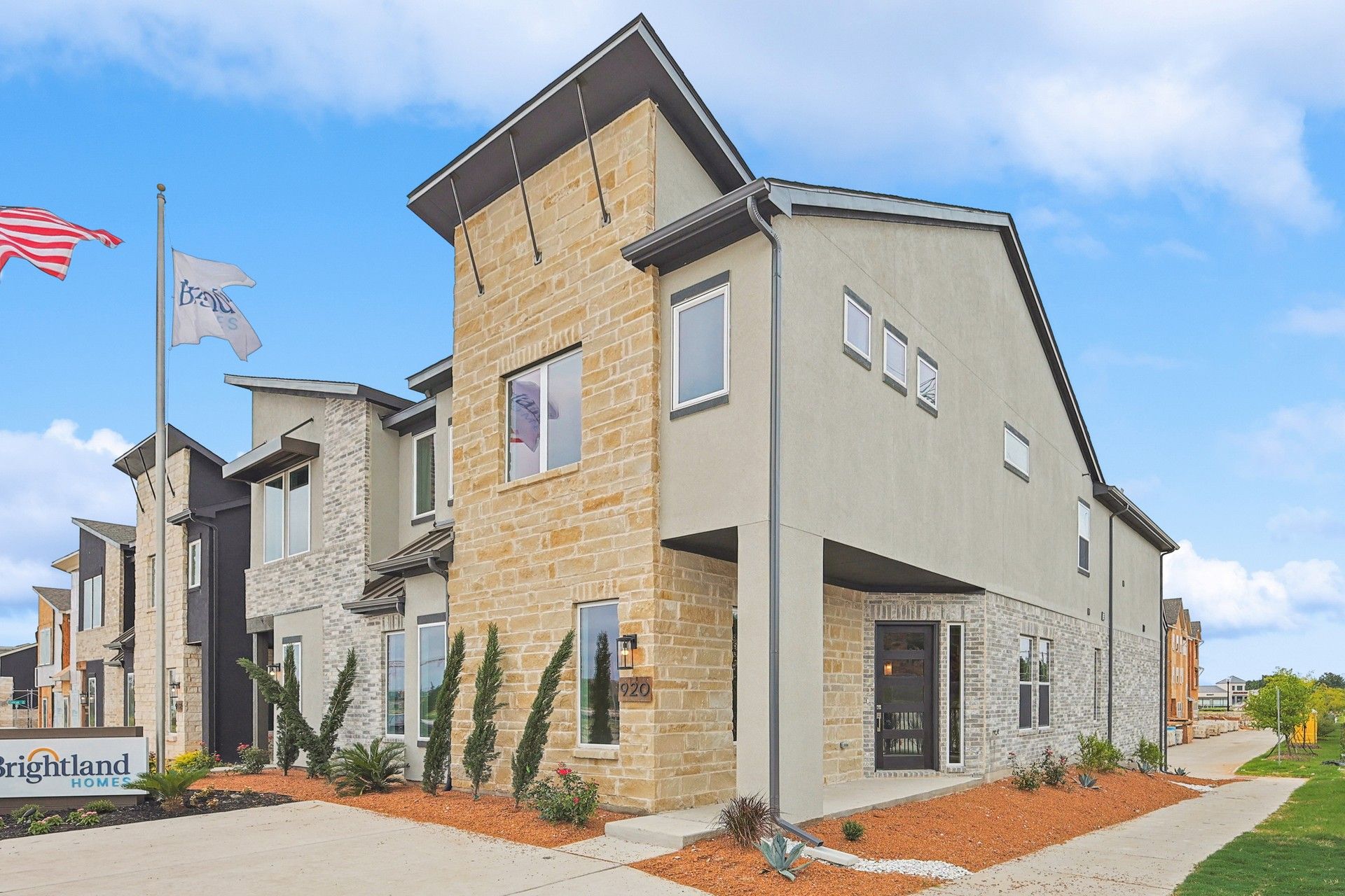 Modern Brick and Stone Townhouse at Prestonwood, Collin Creek:Luxurious stone accents and sleek brickwork define this elegant Prestonwood residence, offering refined sophistication.