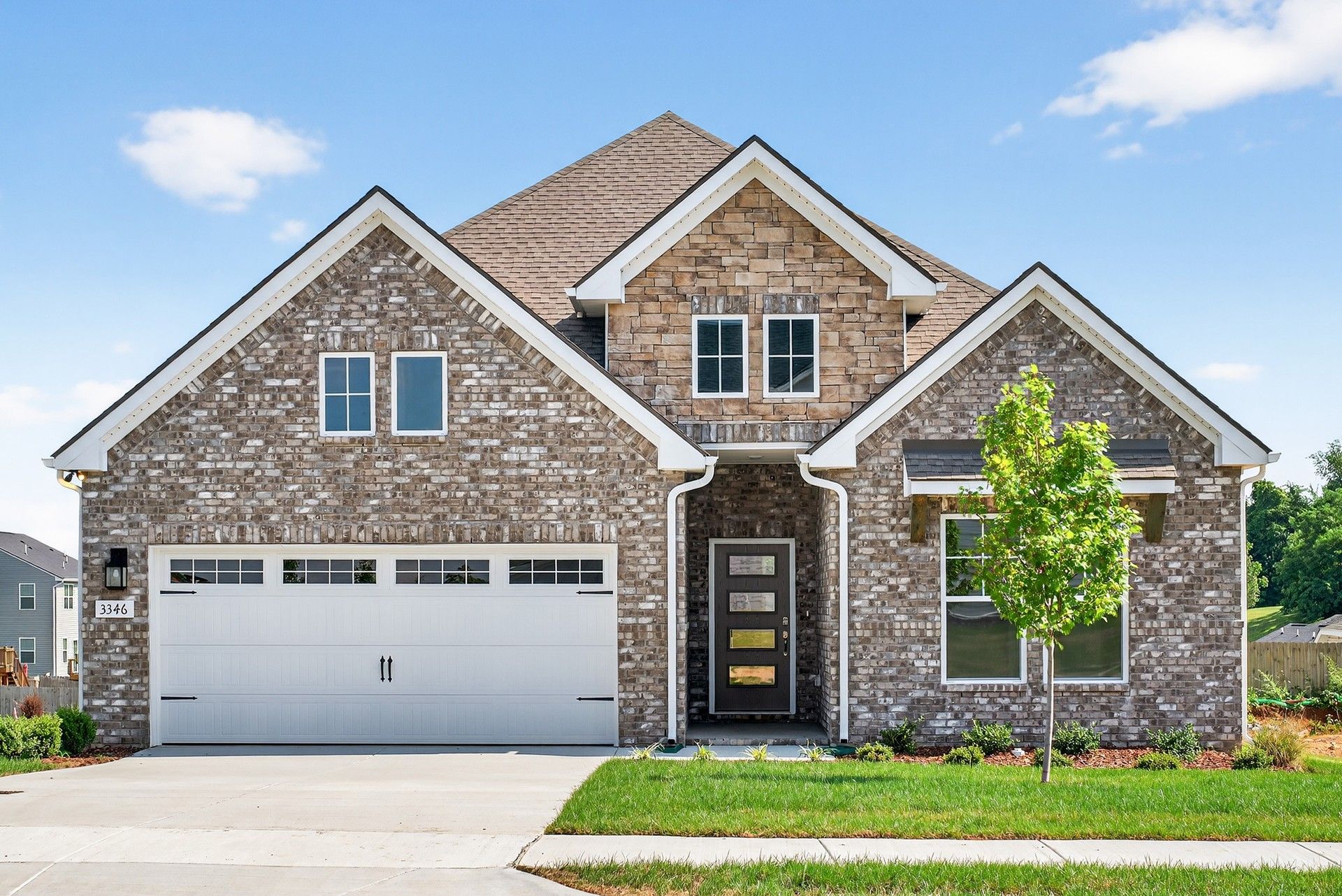 Brick Home with Gabled Roof at Harpeth, McClure Farms:Exquisite brickwork and modern gabled roof design define this Harpeth residence in McClure Farms.
