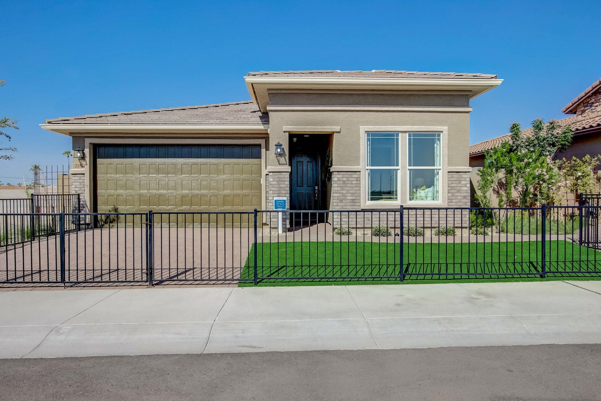 Castillo Community Home with Garage and Brick Details at Anderson Parc:Elegant single-story residence with striking brickwork and pristine facade in Anderson Parc, Castillo community.