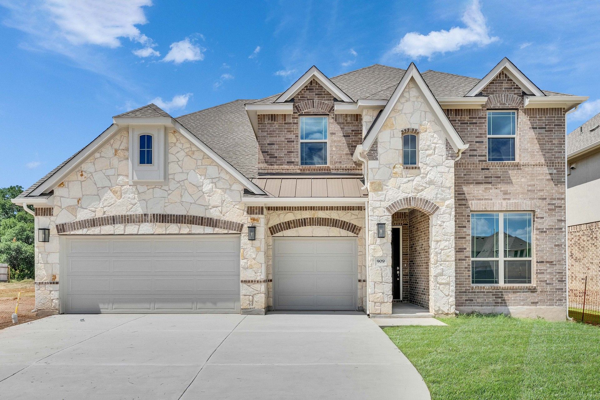 Luxury Stone and Brick Home in Hawkes Landing:Exquisite stone facade, arched entries, and refined shutters define this Hawkes Landing masterpiece.